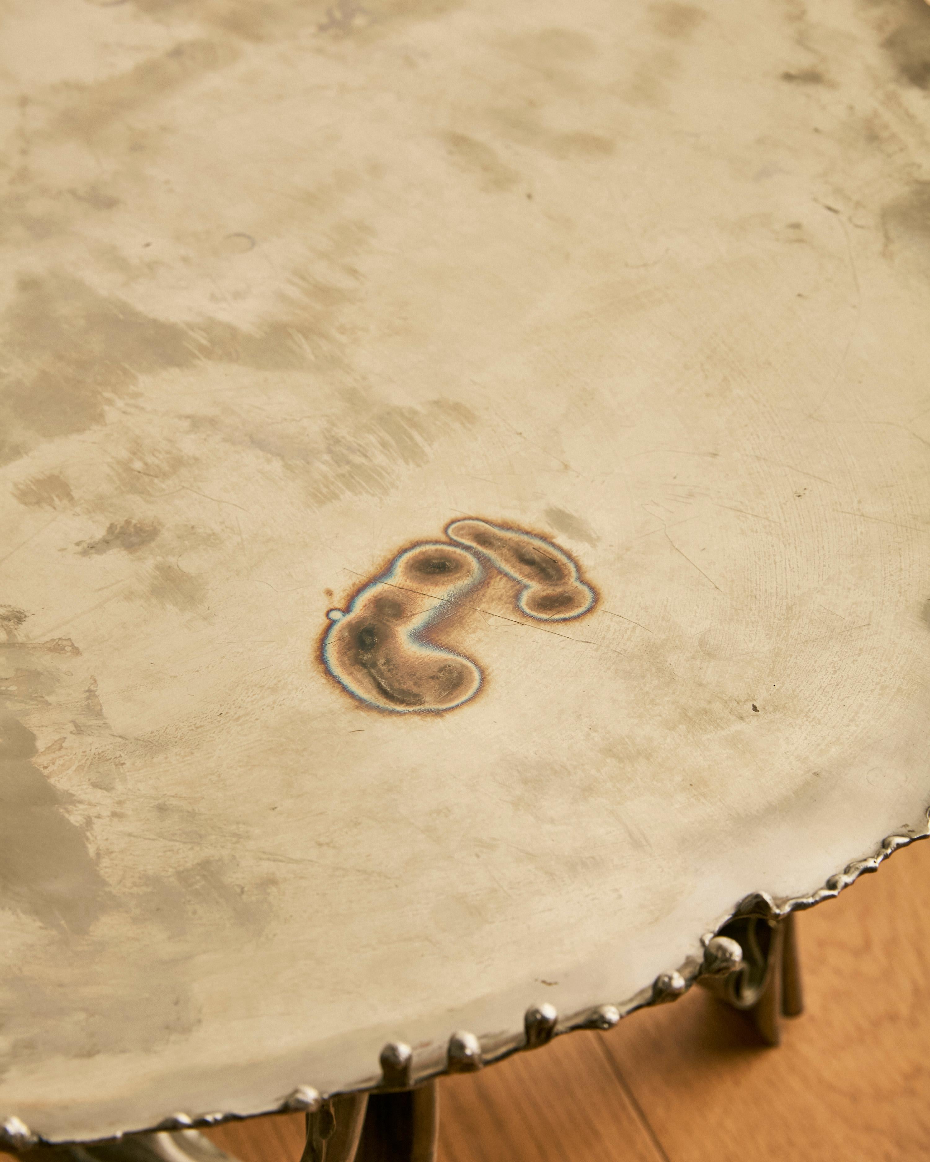 Mesa baja escultórica de acero Albert Feraud Acero en venta