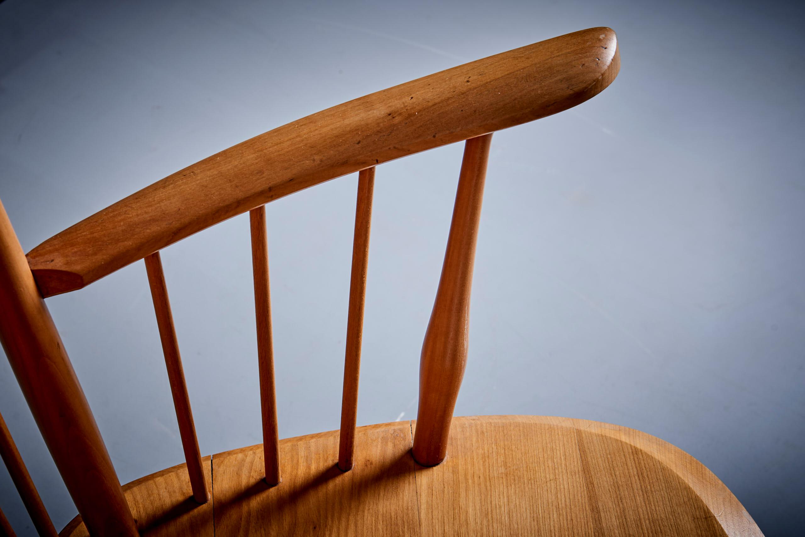 Rare high wingback edition of the architectural Arts & Crafts chair by Albert Haberer for Hermann Fleiner, Stuttgart, circa 1949. The flexible backrest is made of thin spindles, held together with a leather connection. The leather is a beautiful