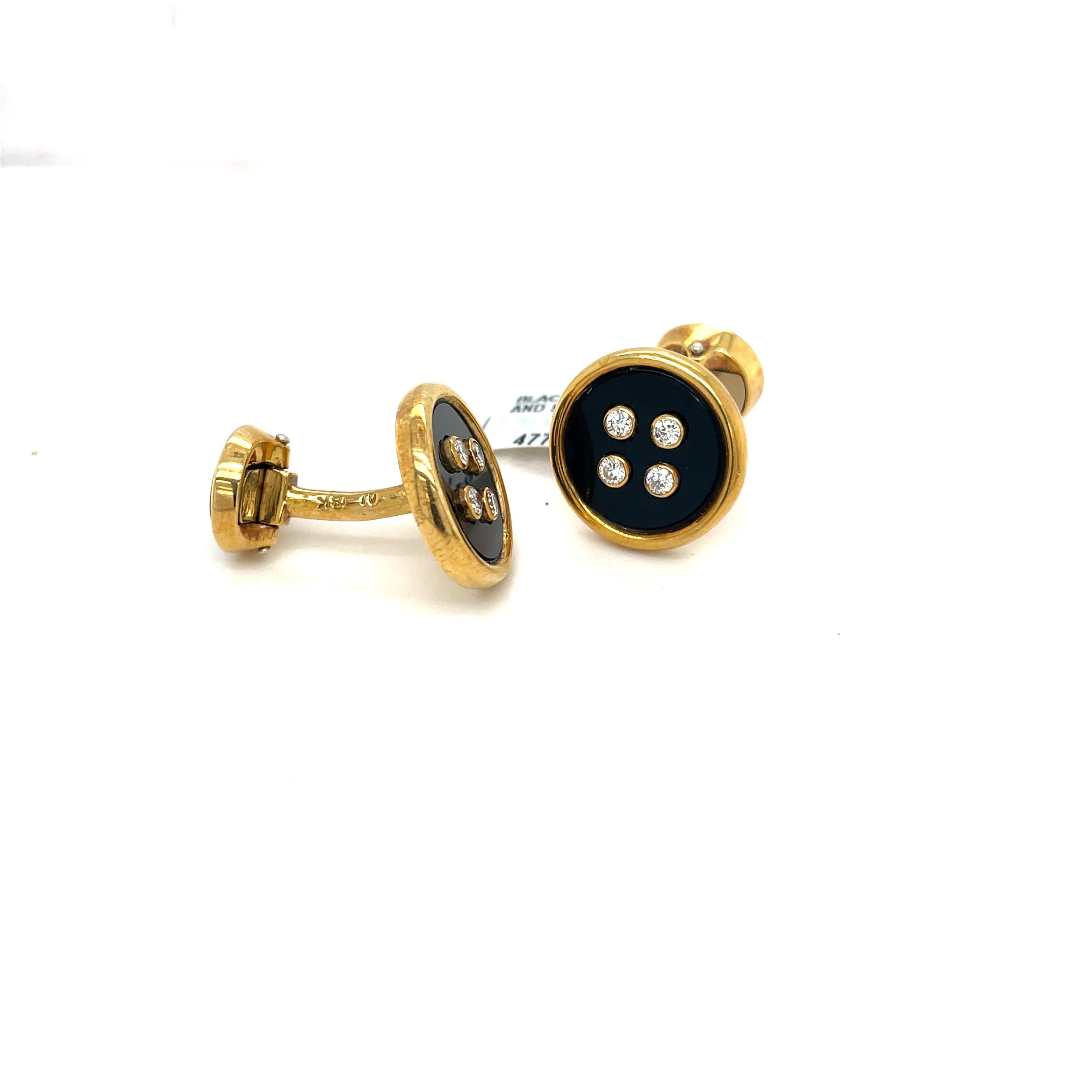 18 karat yellow gold  and black onyx round cuff links. The double sided cuff -links are set with 4 bezel set diamonds on each onyx section. The cuff-links are accompanied by 3 studs of the same.
Stamped  AL 18 K