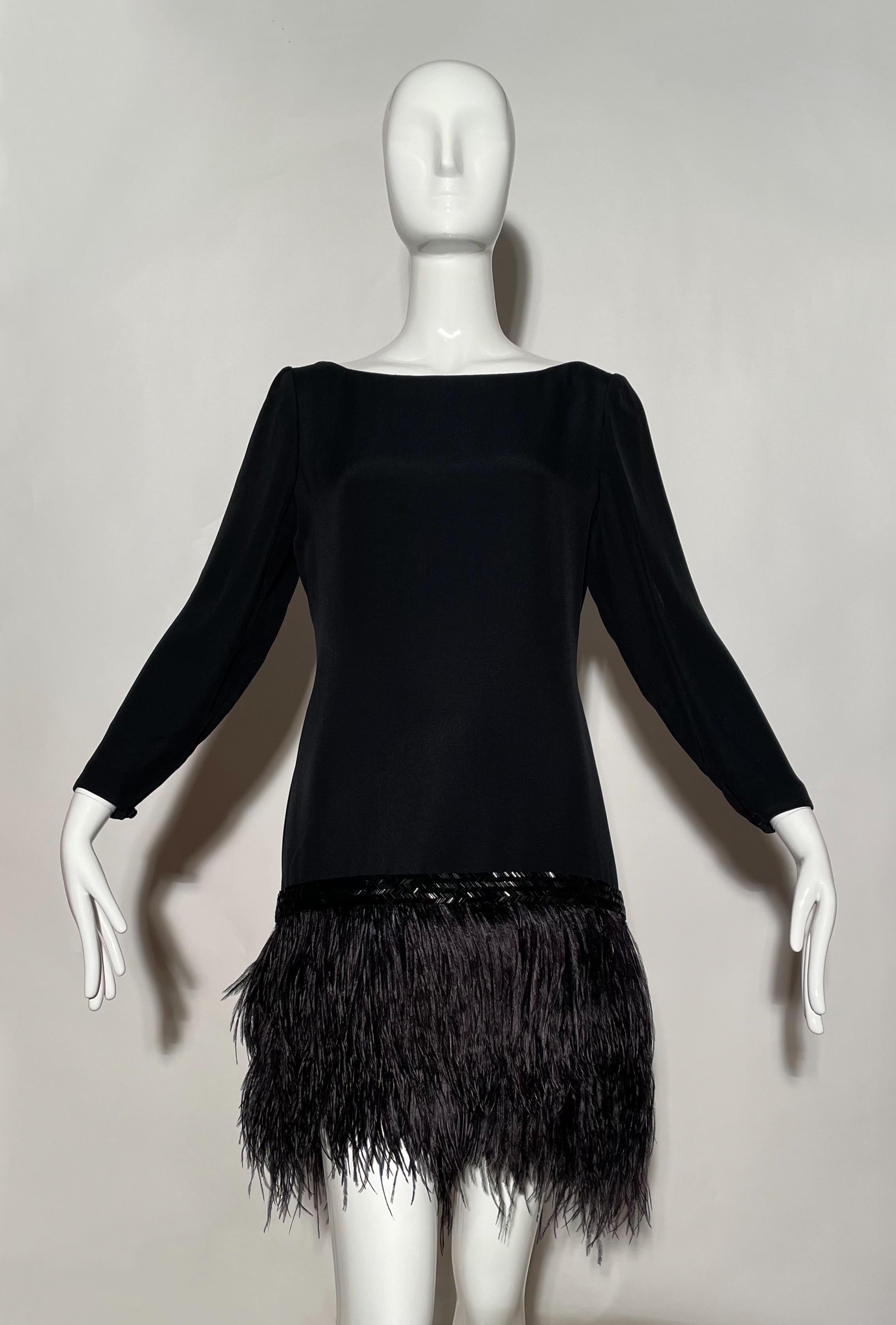 Black cocktail dress. Ostrich feather skirt. Beaded trim. Wide neckline. Zipper on back. Rayon and acetate. Lined. Made in USA.
*Condition: excellent vintage condition. No visible flaws.

Measurements Taken Laying Flat (inches)—
Shoulder to