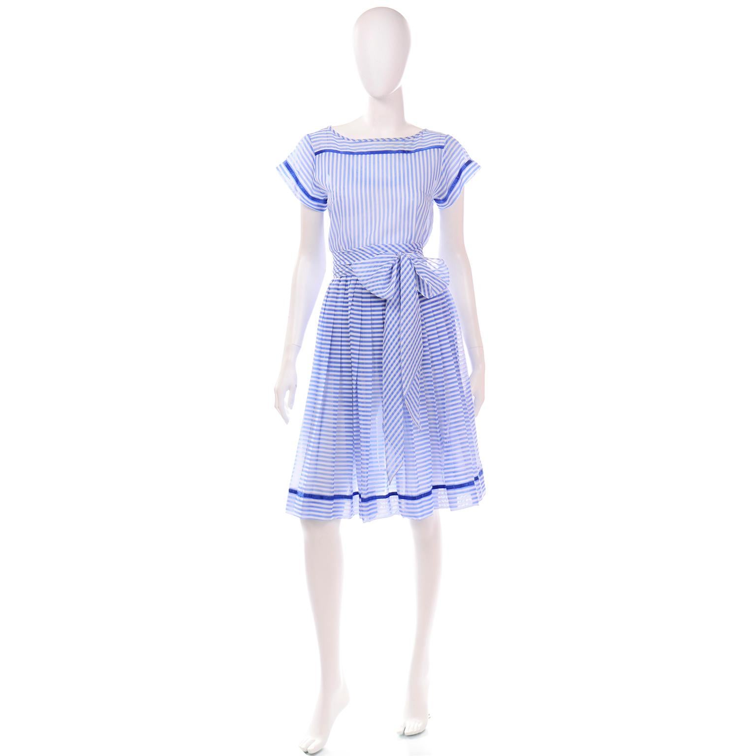 This is a pretty, airy  vintage Albert Nipon blue and white striped 2 piece dress that comes with its original sash style belt. We love vintage Albert Nipon dresses and they are so perfect to incorporated into a modern wardrobe!  Albert's wife Pearl