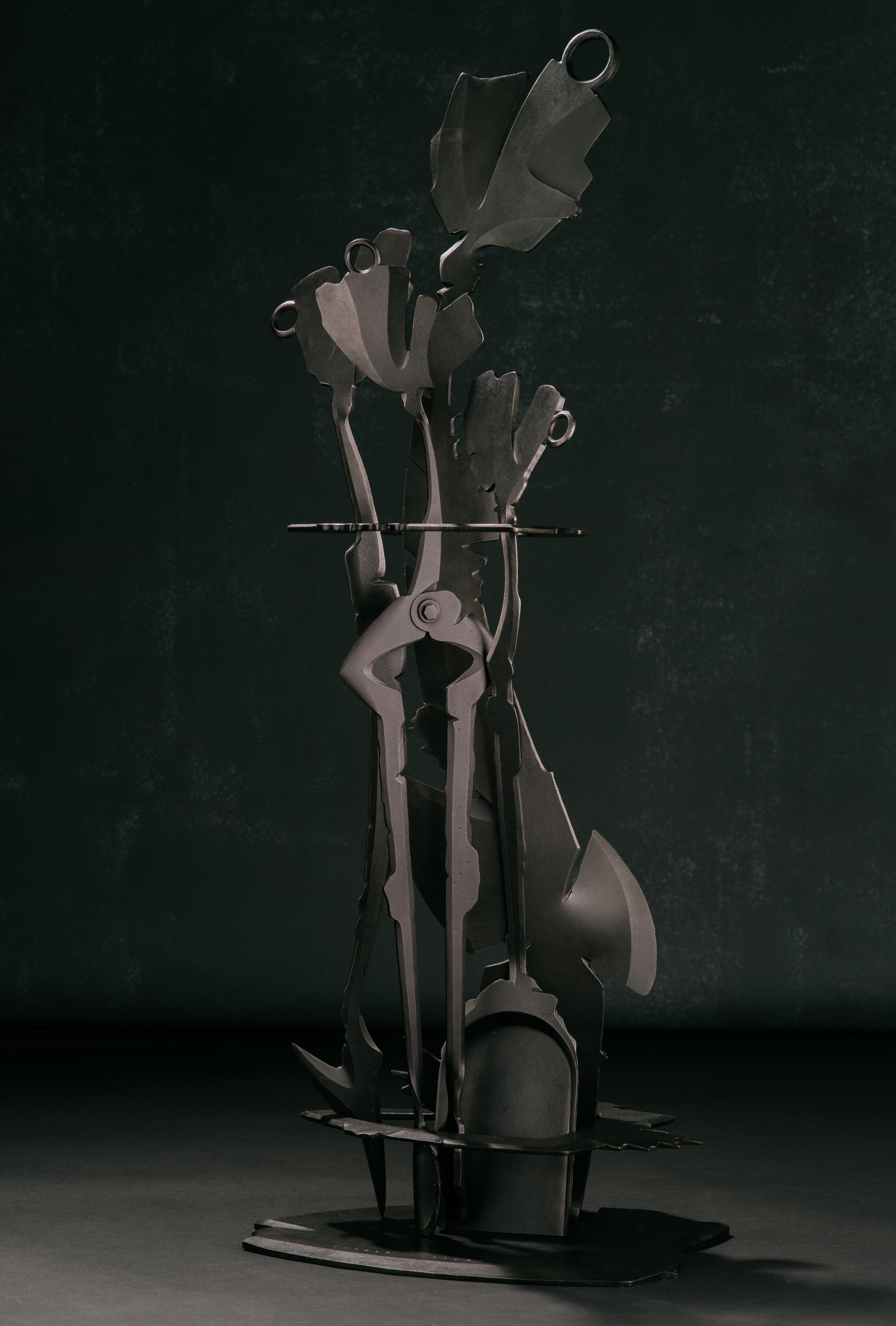A set of fire tools by Albert Paley in formed and fabricated steel with a blackened finish, comprising a stand with three implements - - poker, shovel, and tongs. An exceptionally executed and decadent design with sharp outlines evocative of a rough