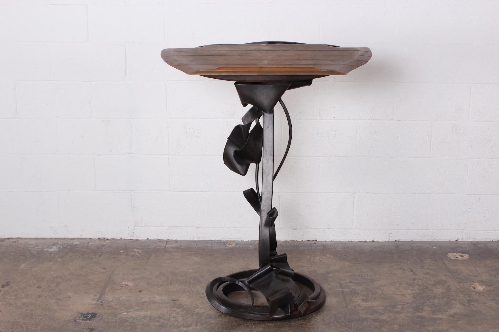 A bronze and forged steel lectern by Albert Paley signed and dated 1990.