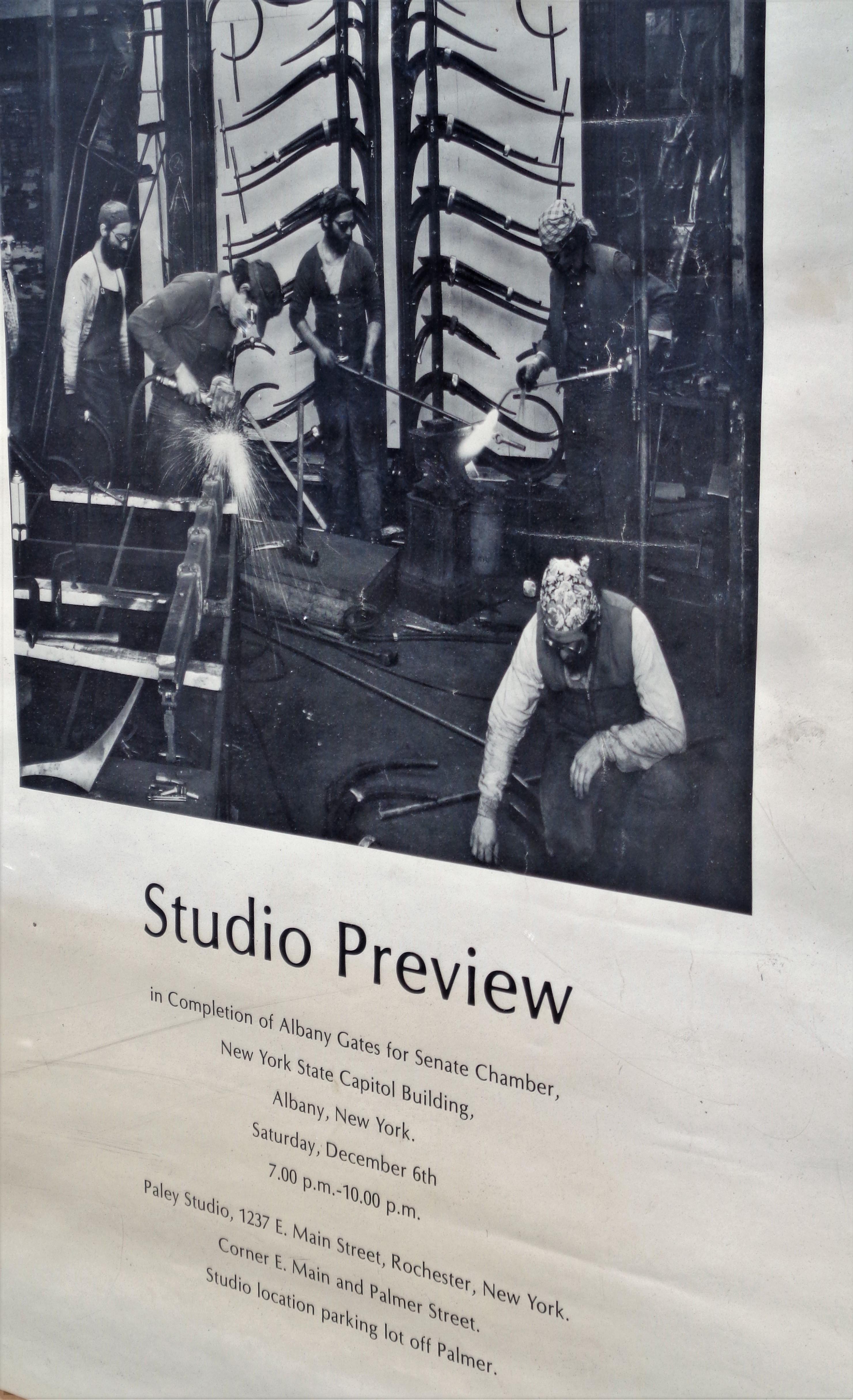 A hard to find early Albert Paley exhibition poster on paper with a striking industrial style photographic image of Albert and his team using blow torches while constructing the Albany gates for the Senate Chamber, New York State Capitol Building,