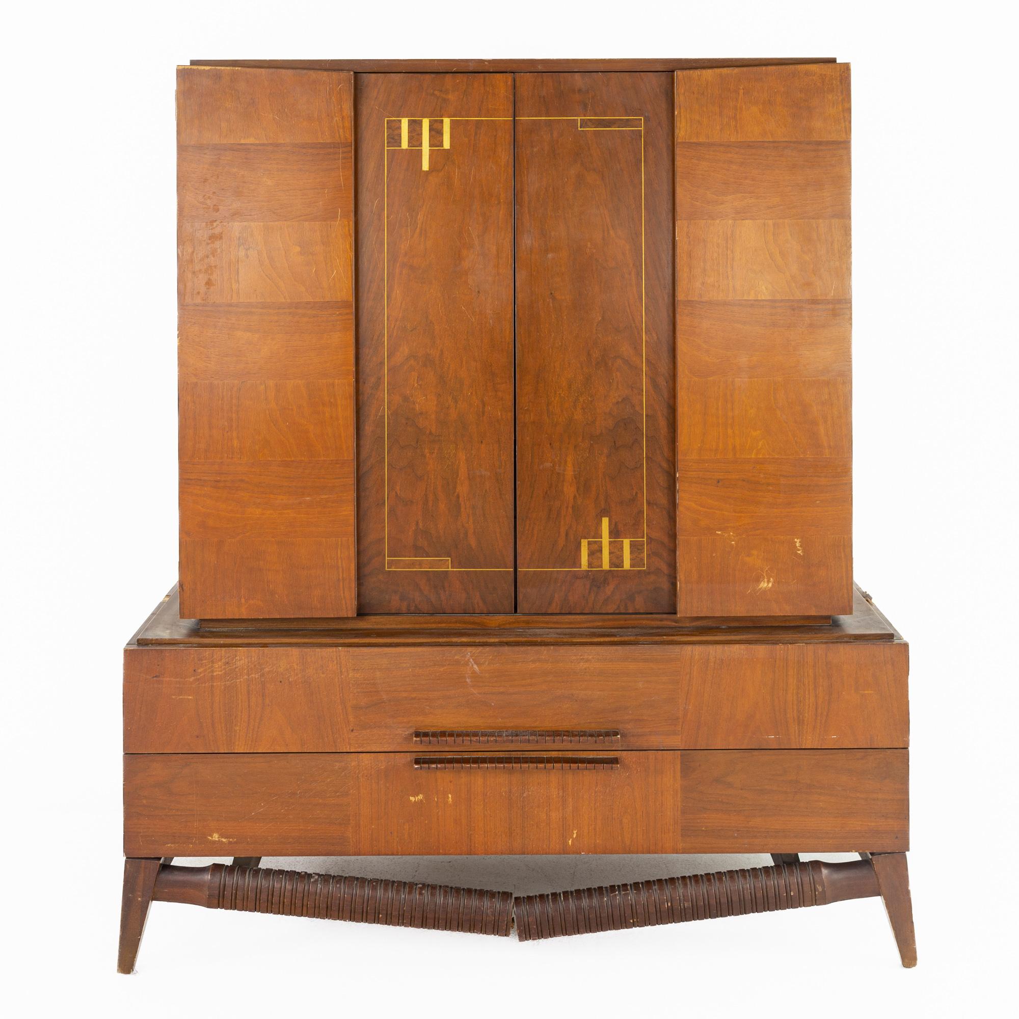 Albert Parvin style mid century walnut highboy dresser gentlemans chest armoire.

This dresser measures: 48 wide x 22 deep x 57 inches high.

All pieces of furniture can be had in what we call restored vintage condition. That means the piece is