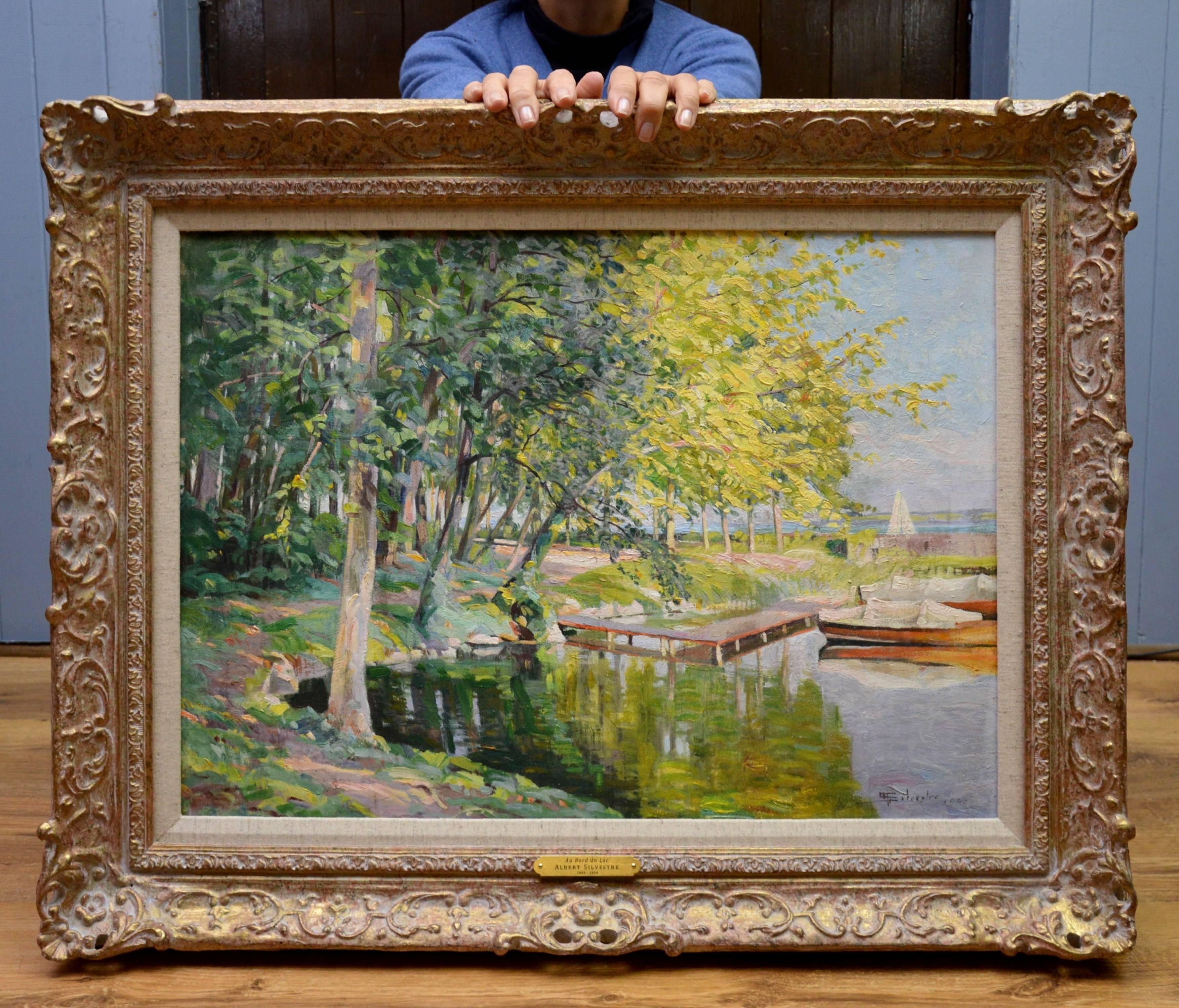 This is a large fine original Post-Impressionist oil on canvas depicting a rowing boat moored at the side of a lake in summertime by the eminent Swiss painter Albert Silvestre (1869-1954). ‘Au Bord du Lac’ is signed by the artist and dated 1943.