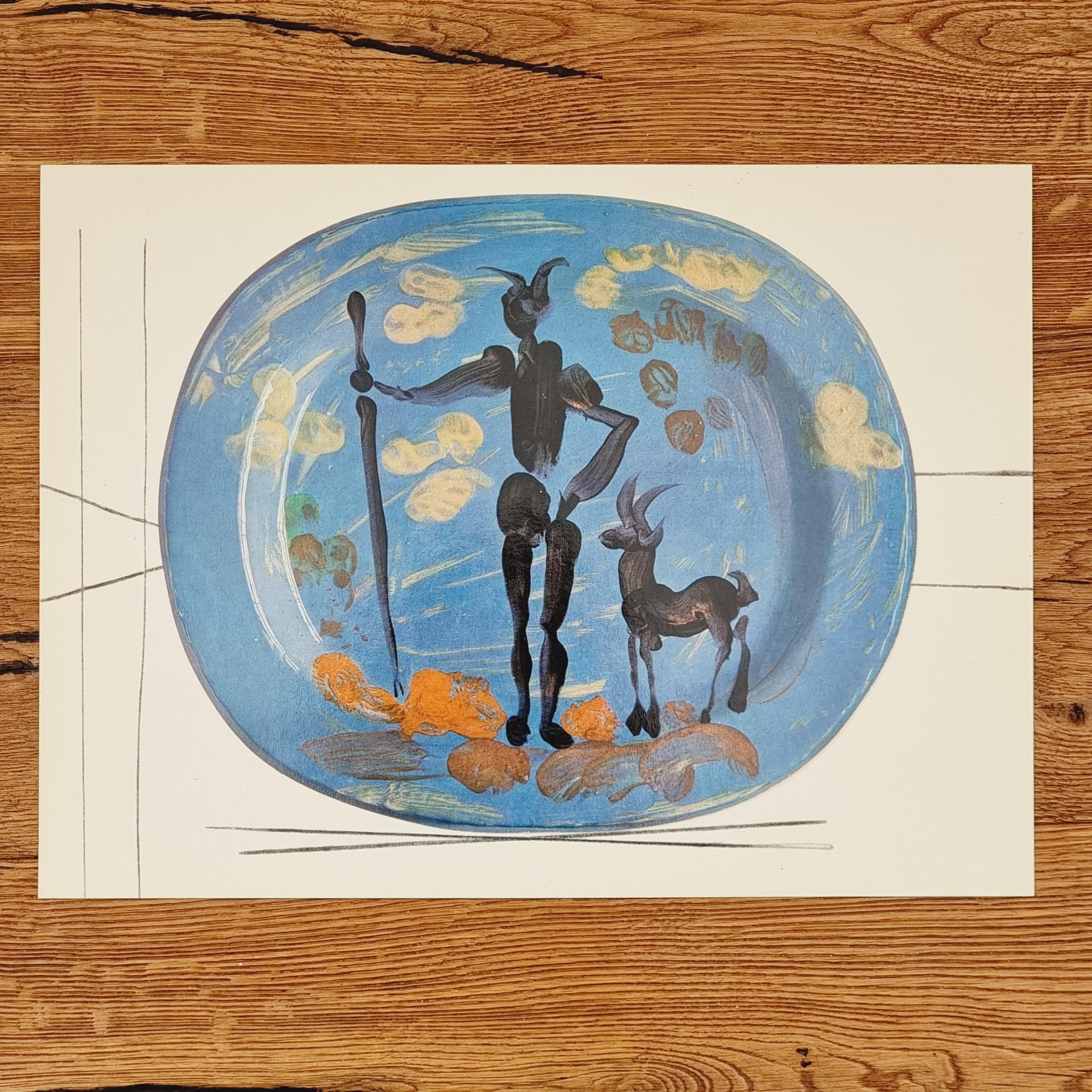 An exquisite shiny polychrome print of Picasso Vallauris ceramic plate depicting shepard and goat. The color print is attached to a thick, high quality paper with decorative lines. 

The print is originally from a Limited Edition Art Folio