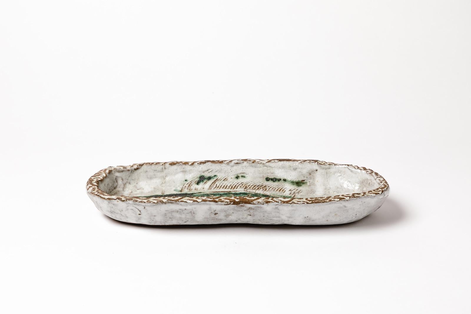Albert Thiry

Grande assiette en céramique grès animalière de l'artiste français, vers 1950

Décoration de poissons avec des couleurs d'émaux céramiques vertes et bleues

Signé sous la base

Conditions d'origine parfaites

Mesures :