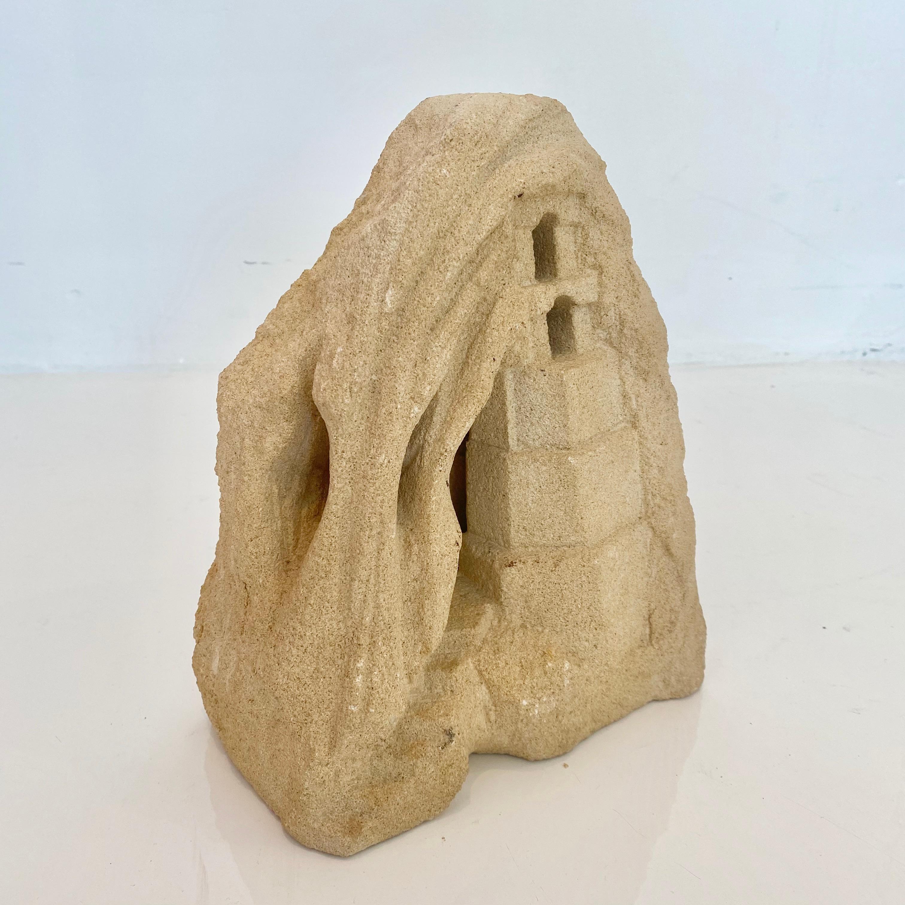 Fantastic carved stone lamp in the shape of a house with two windows and a door. Made in France in the 1970s by French sculptor Albert Tormos. 