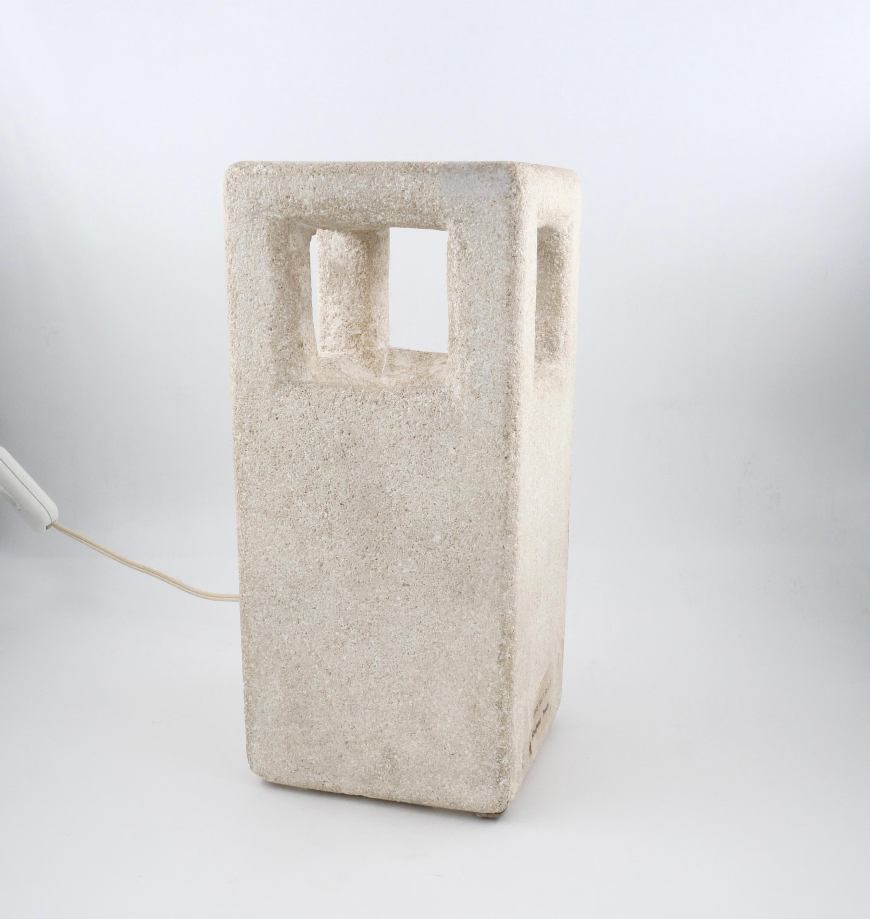 Sculpture lamp made by Albert Tormos in the early 70's. The lamp is carved in the Luberon stone that was found near Saint Tropez where the workshop of Albert Tormos was located.
This sculpture benefits from a double sign of authentication: AT