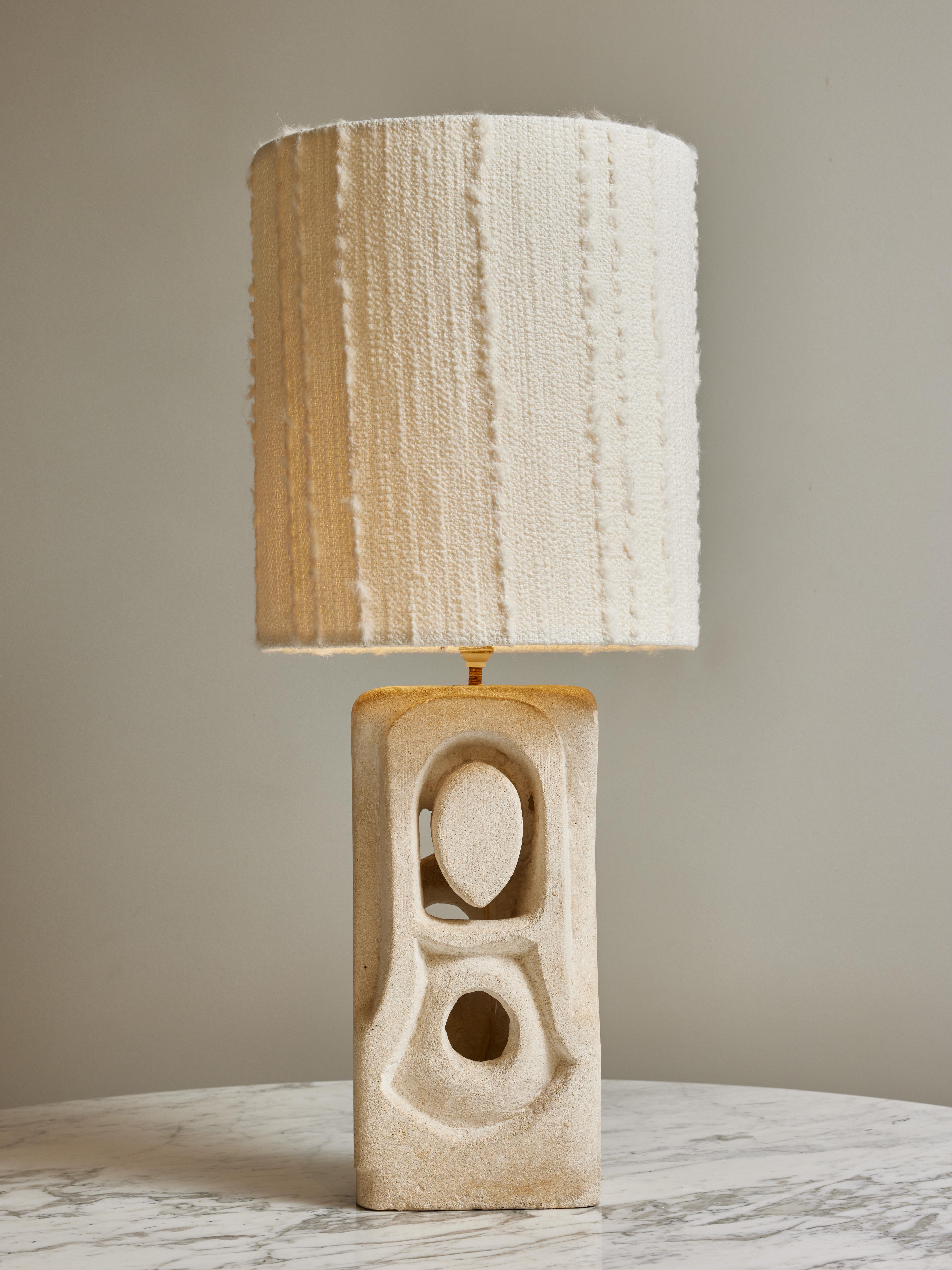 Sandstone table lamp made by the french artist Albert Tormos.
Rectangular shaped with soft angles and edges, this abstract work from Tormos could show a woman/nun figure.

Albert Tormos is a French sculptor painter and poet, known for his lamps and