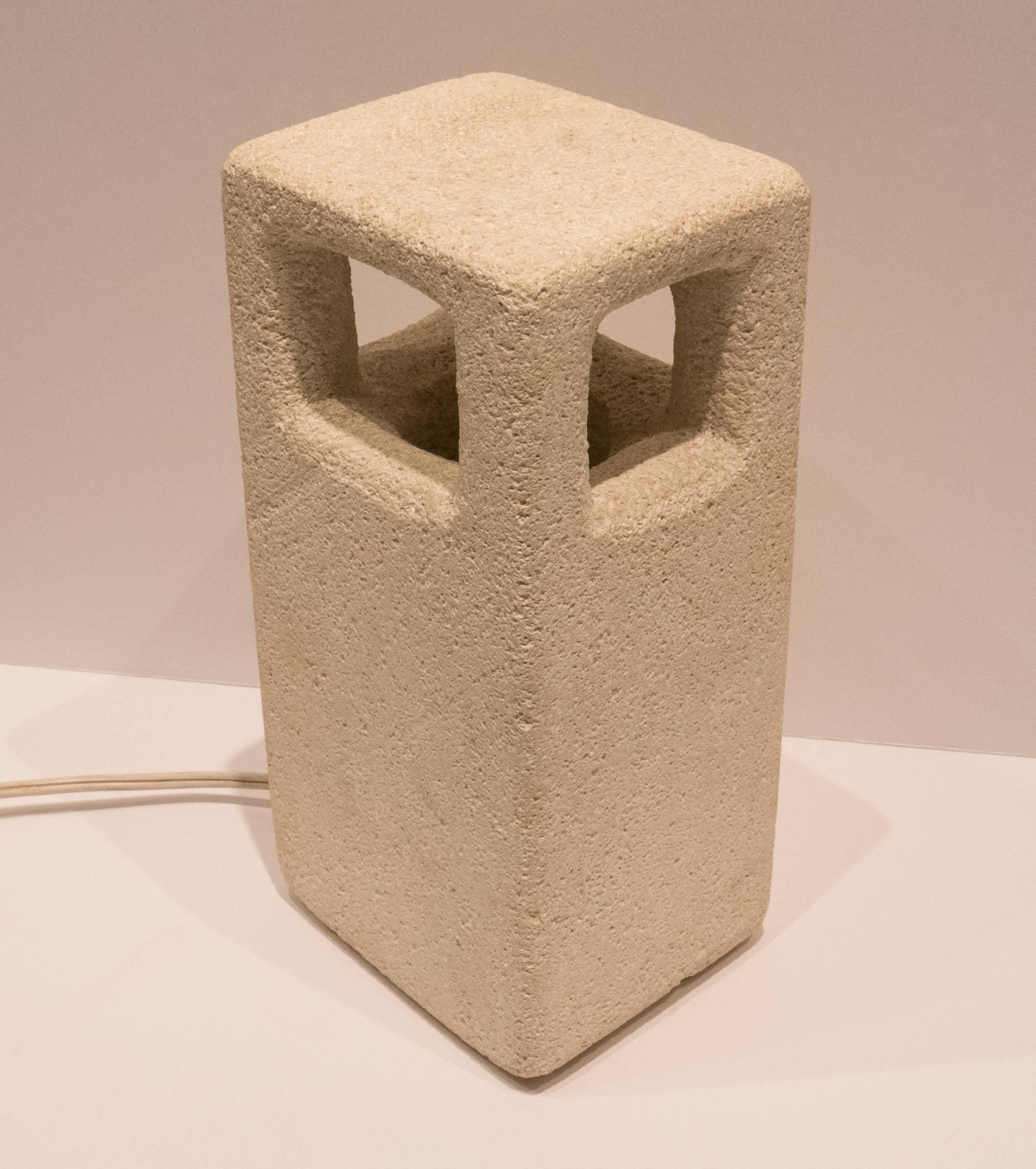 Hand-carved limestone accent light with a minimalist beton-brut architectural bearing. By Vallauris artist Albert Tormos, made circa 1970s. Includes the original clamped housing and wiring in fine working condition. Incised signature 