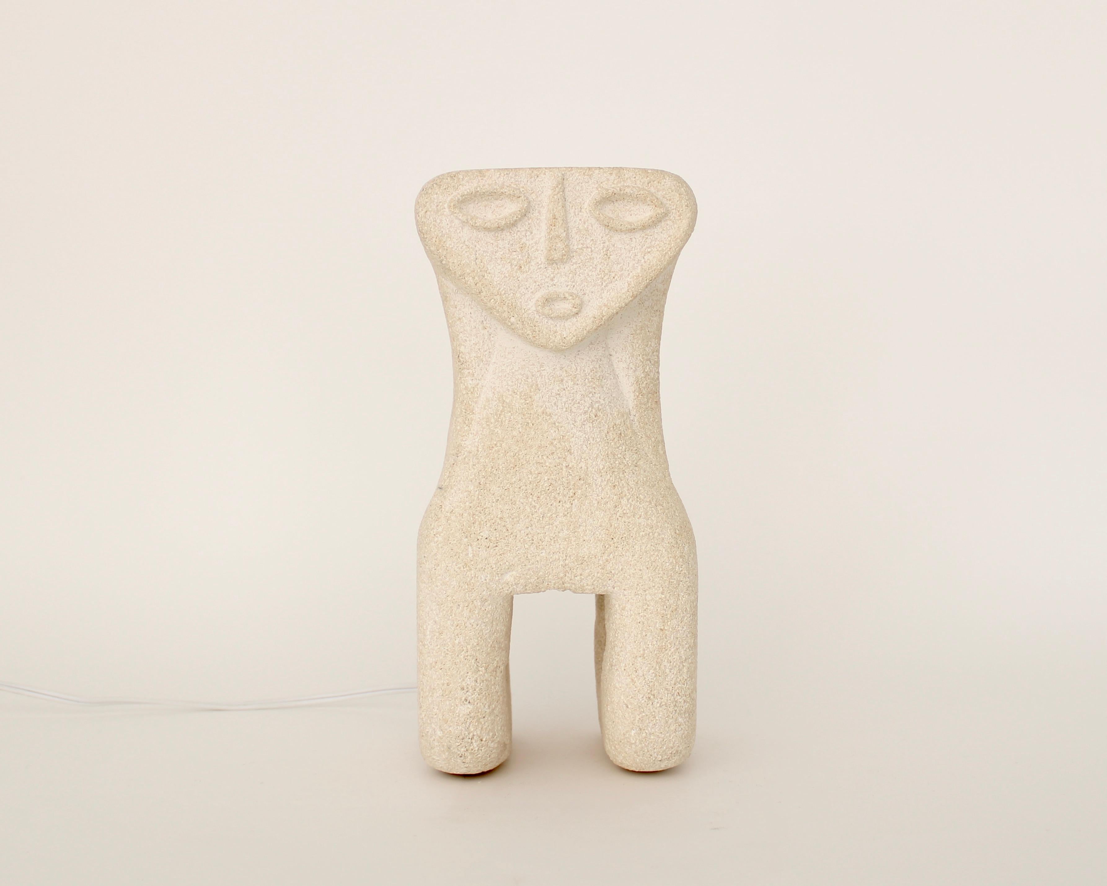 Hand carved French volcanic Luberon limestone or tuff stone lamp with a Minimalist beton-brut architectural bearing a figurative face reminiscent of archaic faces.
By Vallauris artist Albert Tormos, made circa 1970s.
Tormos also worked in St
