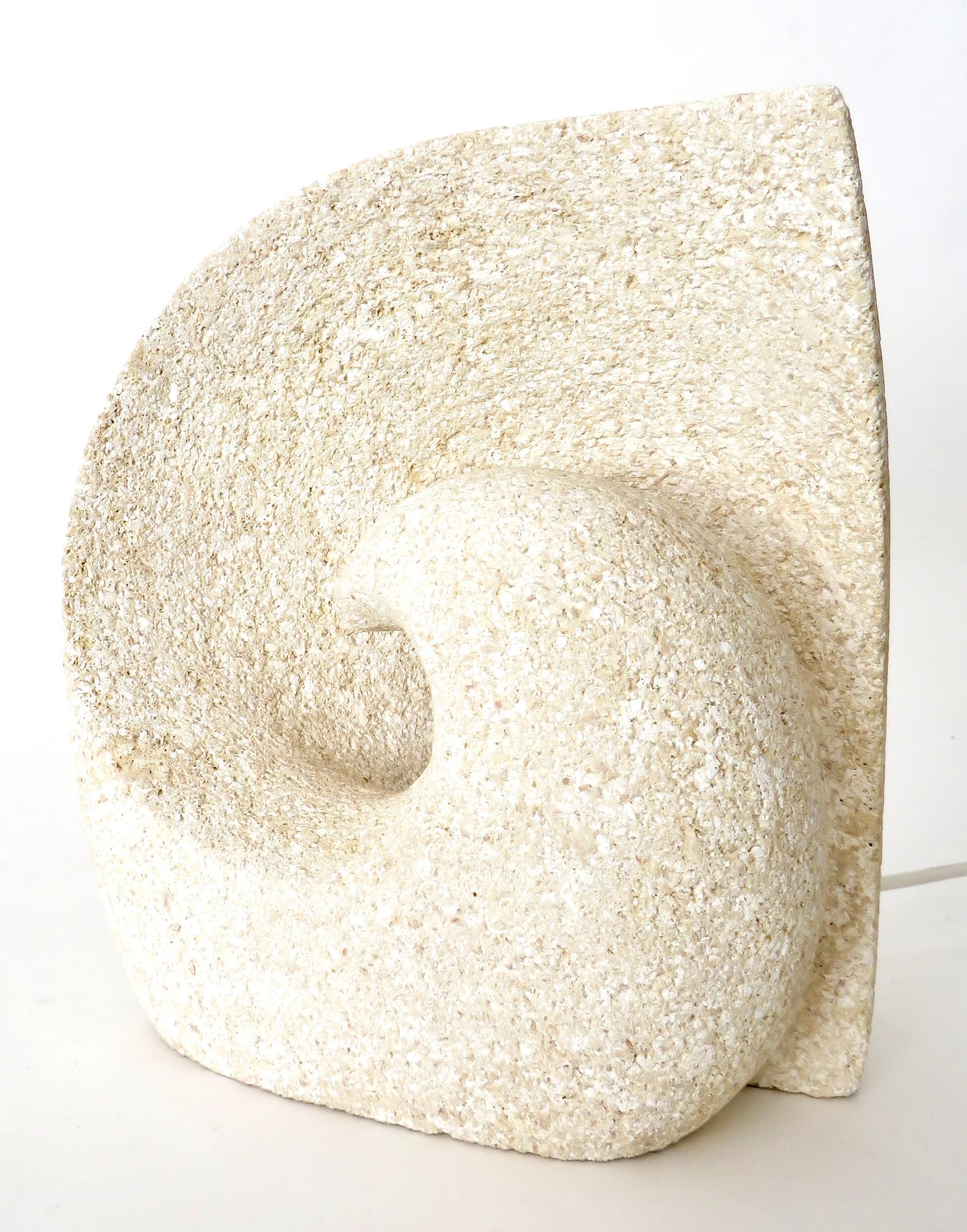 Hand carved French volcanic Luberon limestone or tuff stone lamp with a Minimalist beton-brut architectural bearing.
An unique abstract seashell wave form.
By Vallauris artist Albert Tormos, made circa 1970s.
Tormos also worked in St Tropez