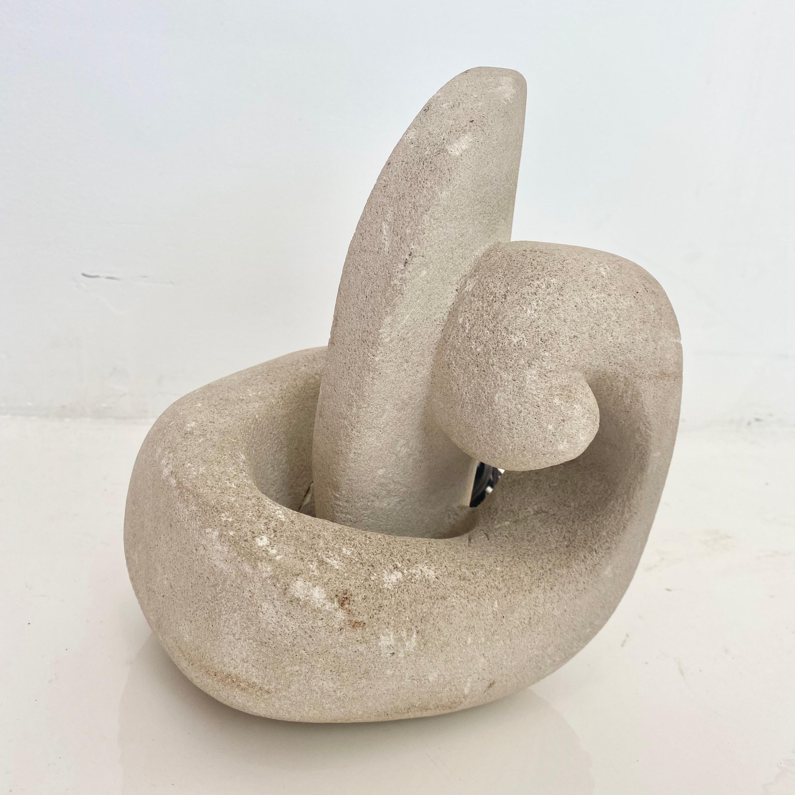 Beautiful carved stone lamp in the shape of a Nautilus. Made in France in the 1970s by French sculptor Albert Tormos. Unique abstract form. Looks great on and off. Hand switch on the cord. Great piece of usable art. Great condition.