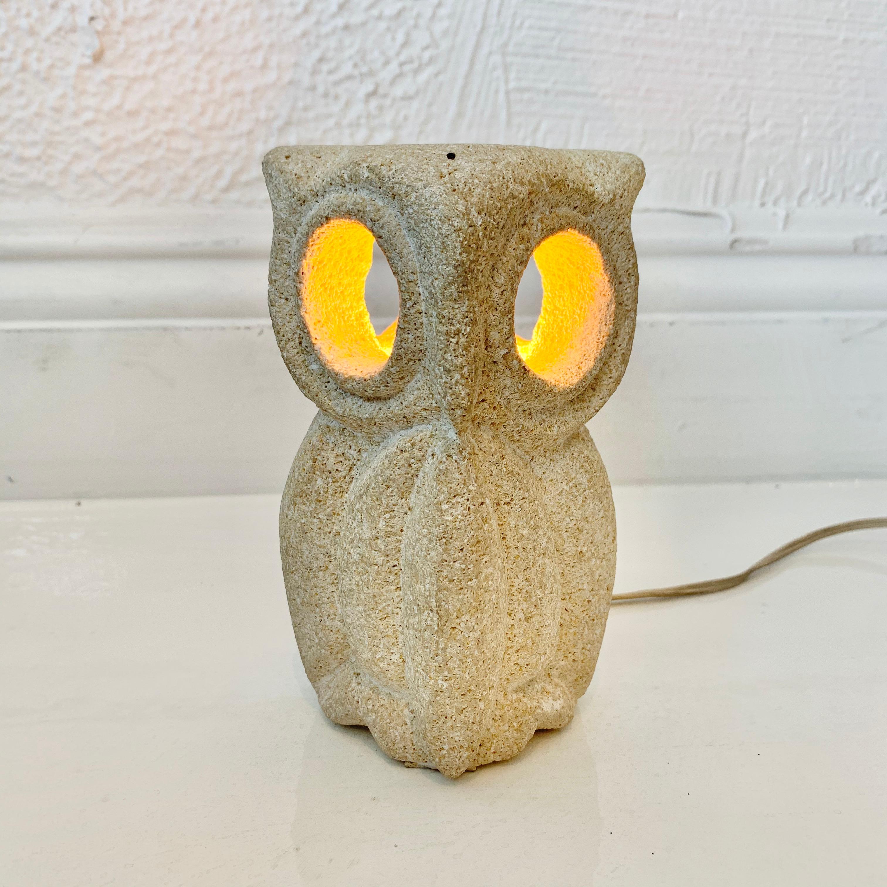 Cunning carved stone lamp of an owl made in France, circa 1970s. Created by French sculptor Albert Tormos. AT initials engraved on the back. Circular cut-outs that allows light through the owl's eyes. Looks great on and off. Hand switch on the cord.