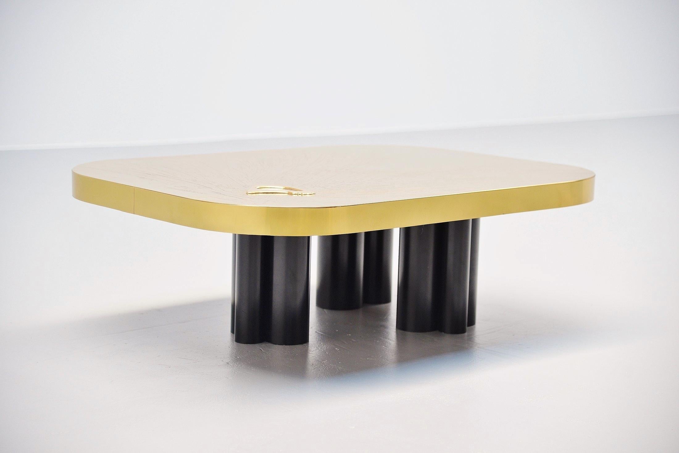 Very nice and decorative coffee table made by Albert Verneuil, Belgium, 1970. This coffee table is made of brass plated wood, hand etched and has a very nice agate in it. The table rests on heavy black metal legs, big tubes welded to each other.