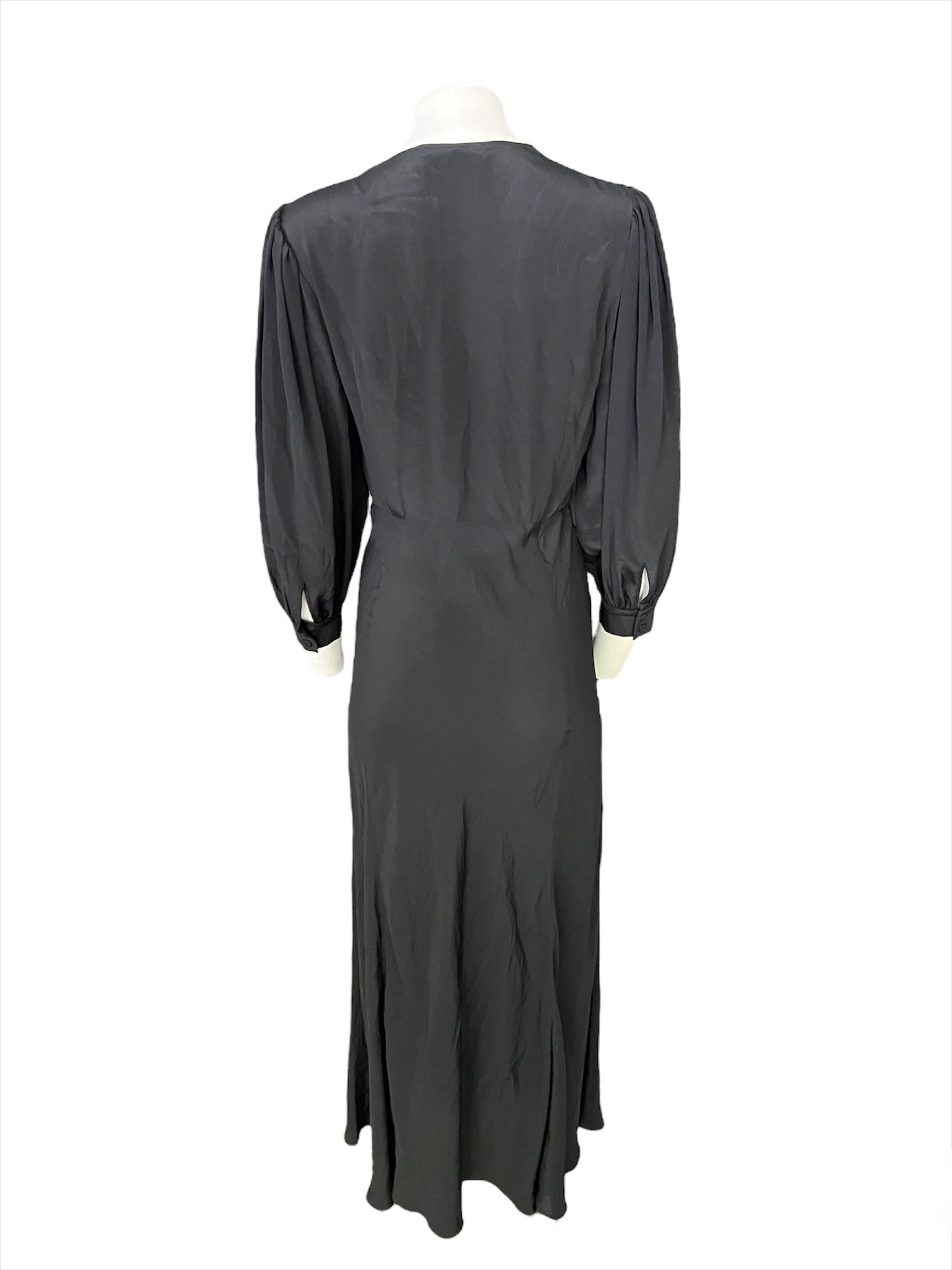 - Long balloon sleeves with double button closure
- Deep V neckline
- Floor length
- Concealed side zip closure