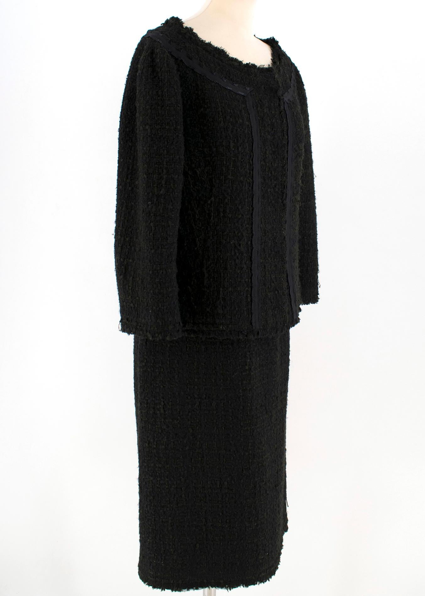 Alberta Ferretti Black Tweed Jacket & Skirt

- Black lining
- Scoop neck
- Jacket: Buttons closure at the front, skirt: zip closure at the back.

Please note, these items are pre-owned and may show some signs of storage, even when unworn and unused.