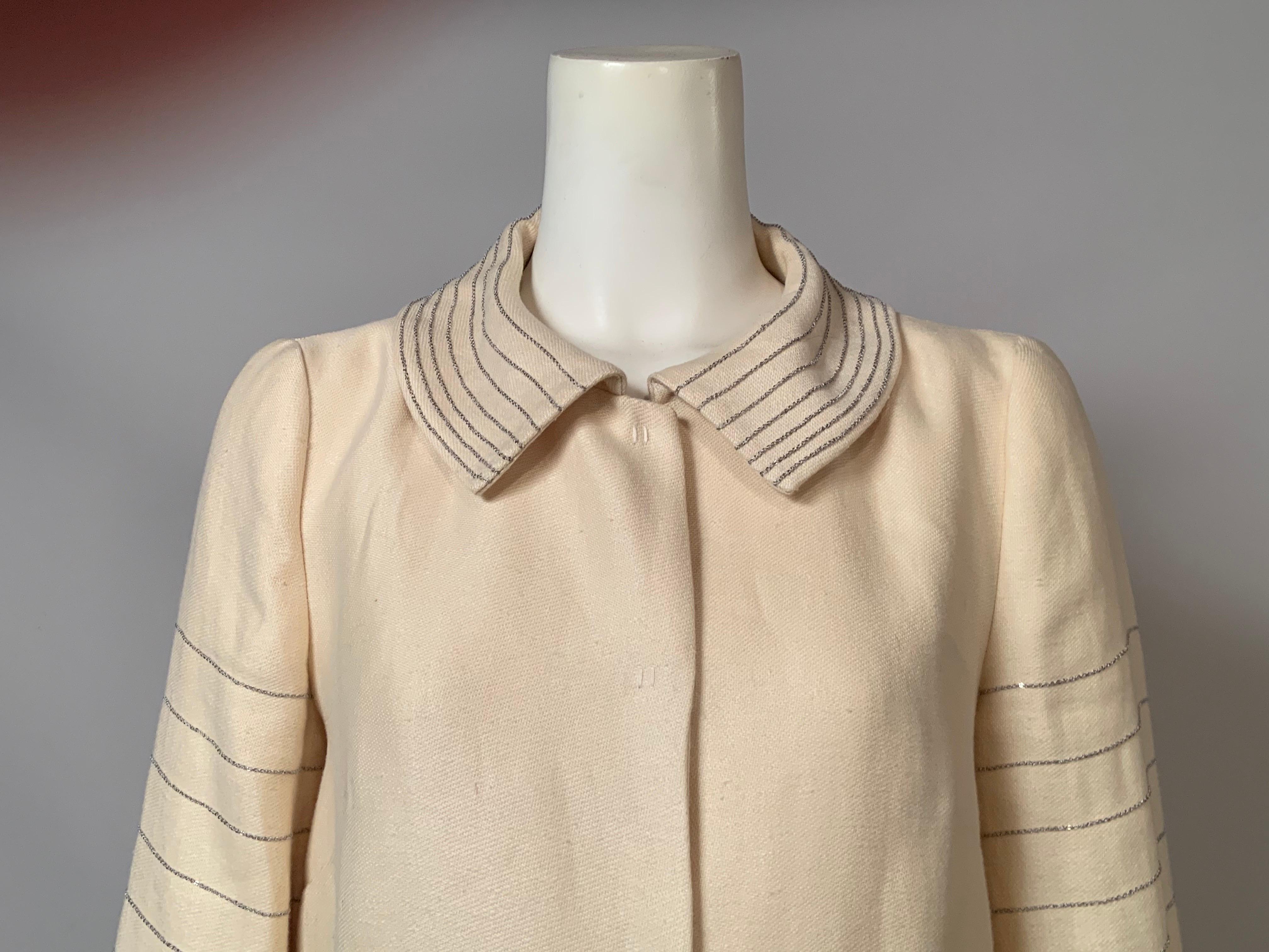 This Alberta Ferretti chain trimmed coat made from hemp is fascinating.  The classic shape of the coat is a perfect foil for the unusual decoration and choice of fabric.  Rows and rows of the thinnest chain decorate the collar, the bracelet length