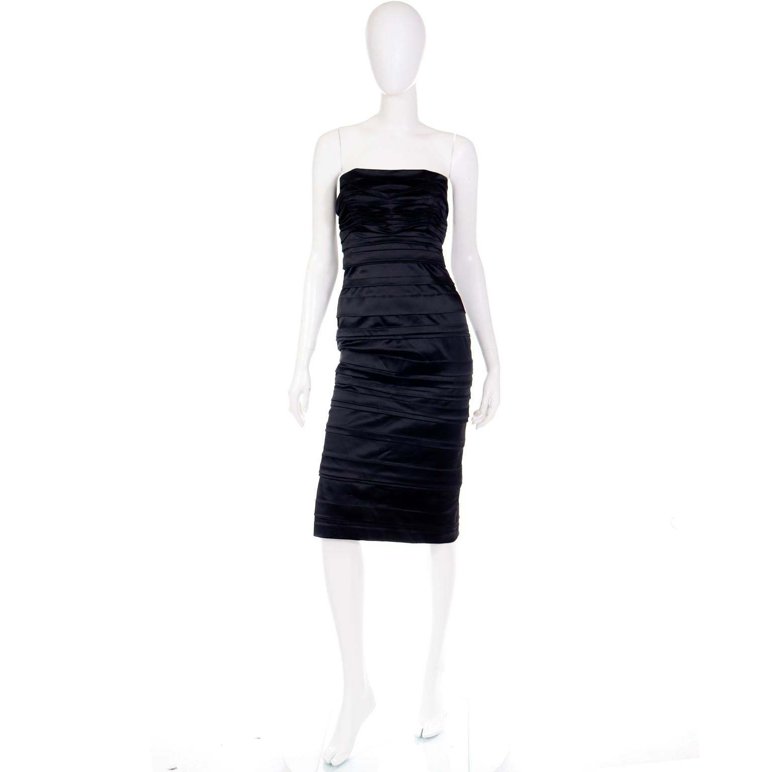 This deadstock Alberta Ferretti strapless black satin evening dress has intricate gathering or ruching throughout and enough stretch to hug the body and create a beautiful silhouette. Far from simple, this dress has so much style and is so