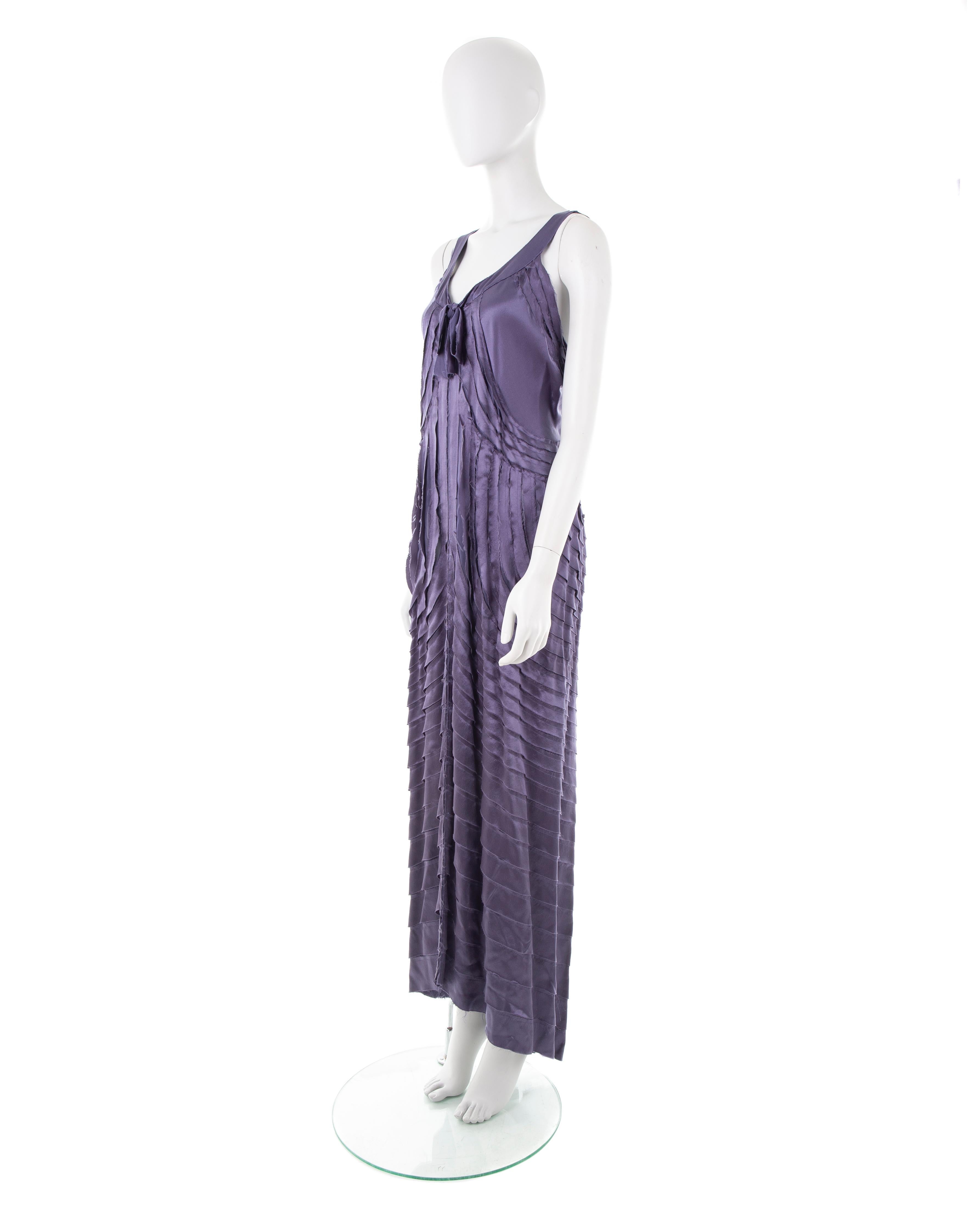 - Purple long evening dress
- Tie bow collar
- Patterned raw-edge strips
