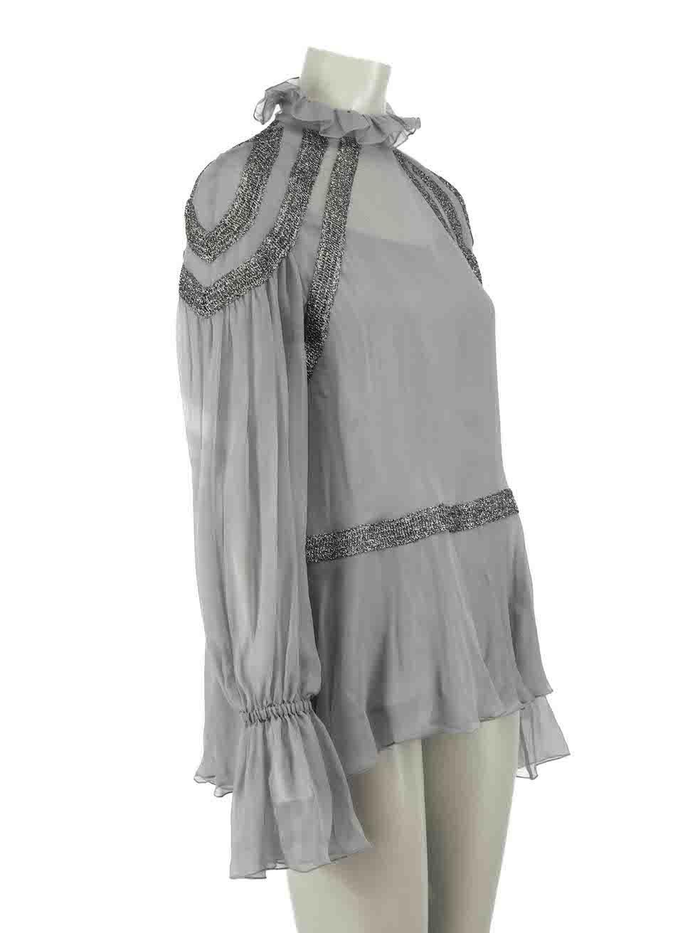 CONDITION is Very good. Minimal wear to blouse is evident. Minimal wear to the right sleeve with small hole and pull to the weave on this used Alberta Ferretti designer resale item.

Details
Grey
Silk
Long sleeves blouse
Sheer
Glitter