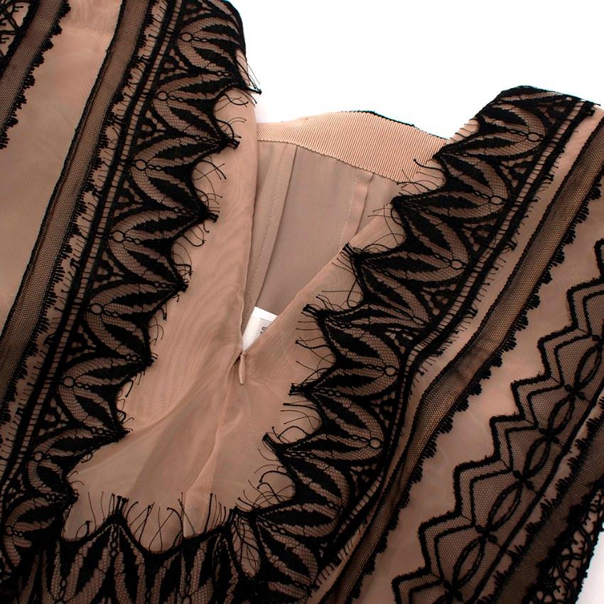 Alberta Ferretti Nude & Black Lace Maxi Skirt

- Full skirt 
- High waist
- Black lace detailing
- Sheer nude fabric
- Side zip fastening 

Materials:
- 100% Nylon
- 100% Rayon
- 73% Cotton
- 27% Nylon
Lining:
- 66% Acetate
- 9% Silk
- 5% Other