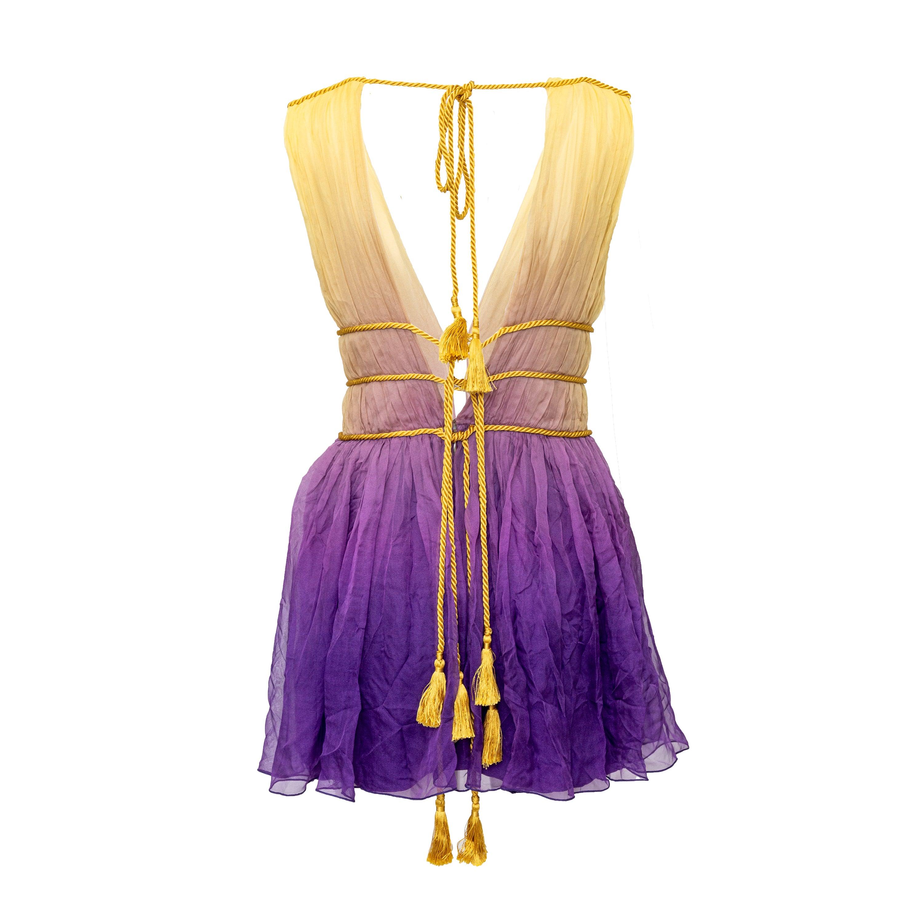 Made of luxurious silk, this Alberta Ferretti mini dress features a stunning yellow and purple ombre gradient. The plunging v-neck is highlighted with pleats and rope details, while the tie-off back and waist ropes offer a flattering silhouette. 
