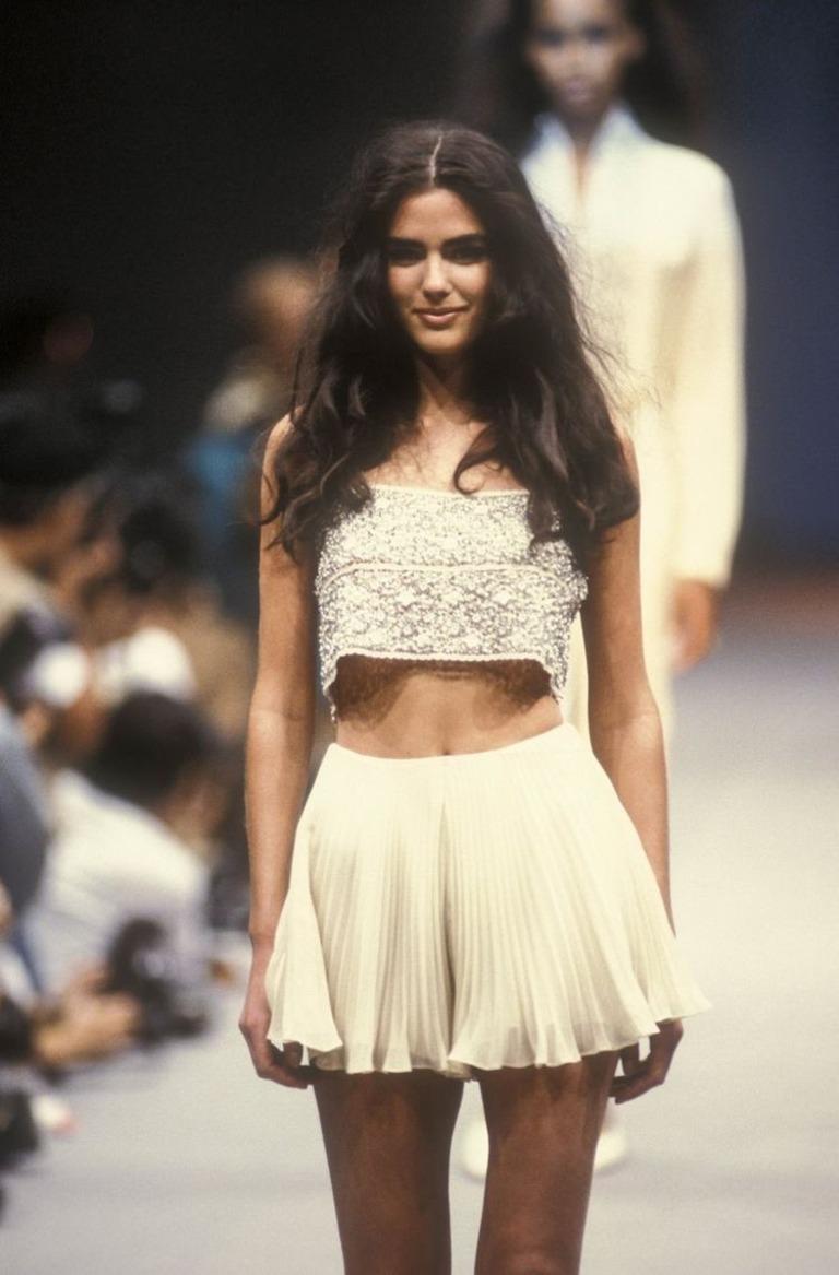 Alberta Ferretti S/S 1991 top
Rayon
Beads and pearls decor
Side zip closure

Marked size 46 IT

Measurements:
bust 84 cm - 33 in
waist 81 cm - 32 in
length 34 cm - 13.5 in

Great condition
Minor signs of age and use