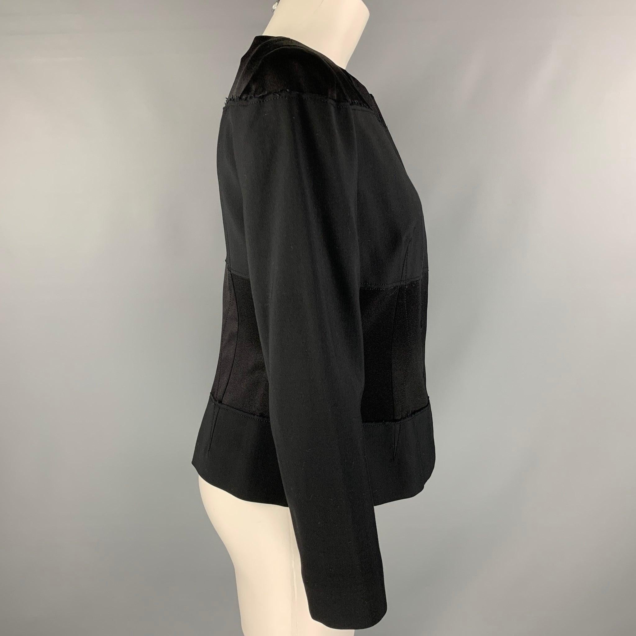 ALBERTA FERRETTI jacket comes in a black rayon fabric featuring a hidden snap button closure and shoulder pads. Made in Italy.Very Good Pre-Owned Condition.  

Marked:   8 

Measurements: 
 
Shoulder: 16 inches Bust: 48 inches Sleeve: 23 inches