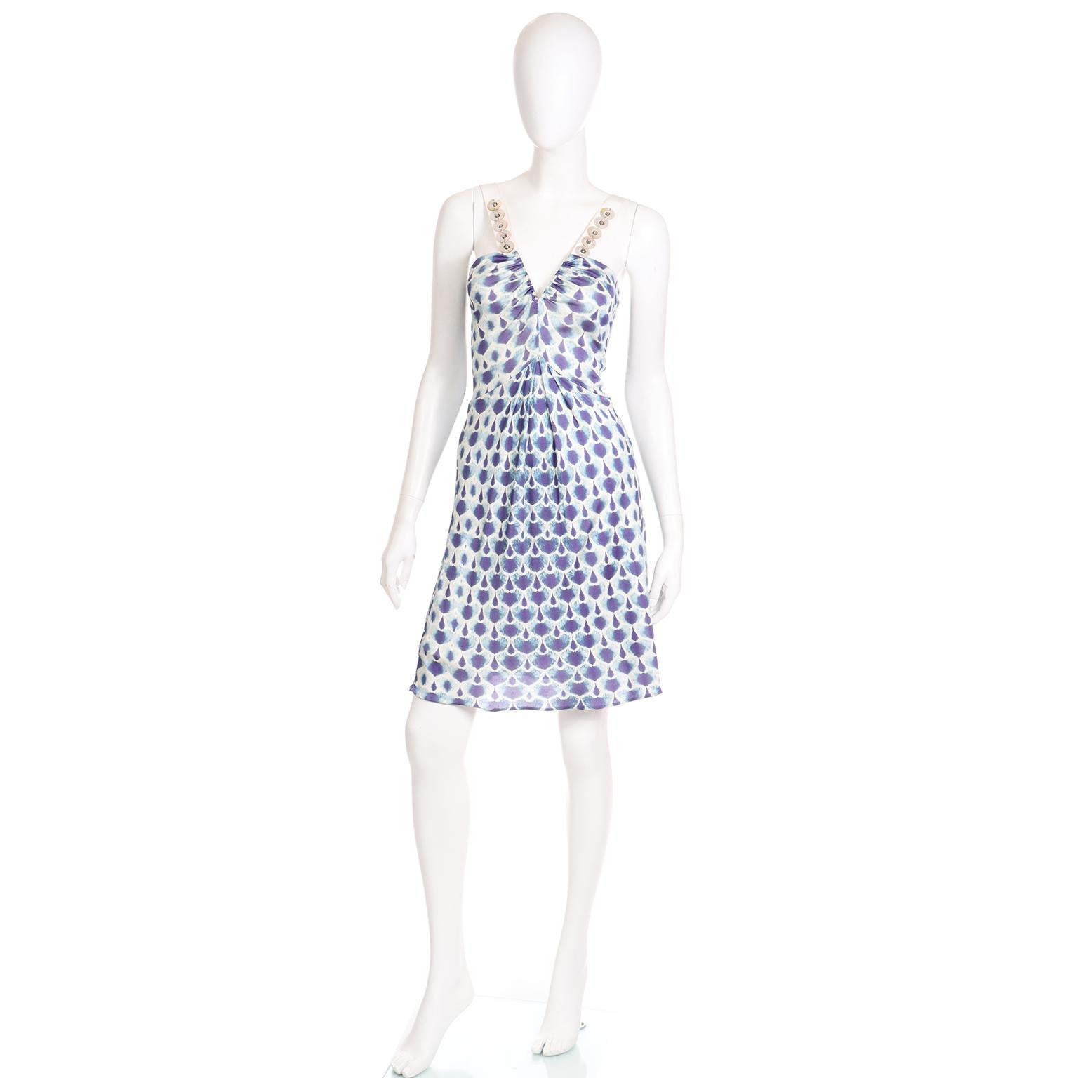 This pretty Alberta Ferretti early 2000's dress would be perfect to take on that summer vacation! The dress slips overhead and has a low V front with gathered bust. The rayon jersey abstract print is in shades of blue, ivory and purple. We love the
