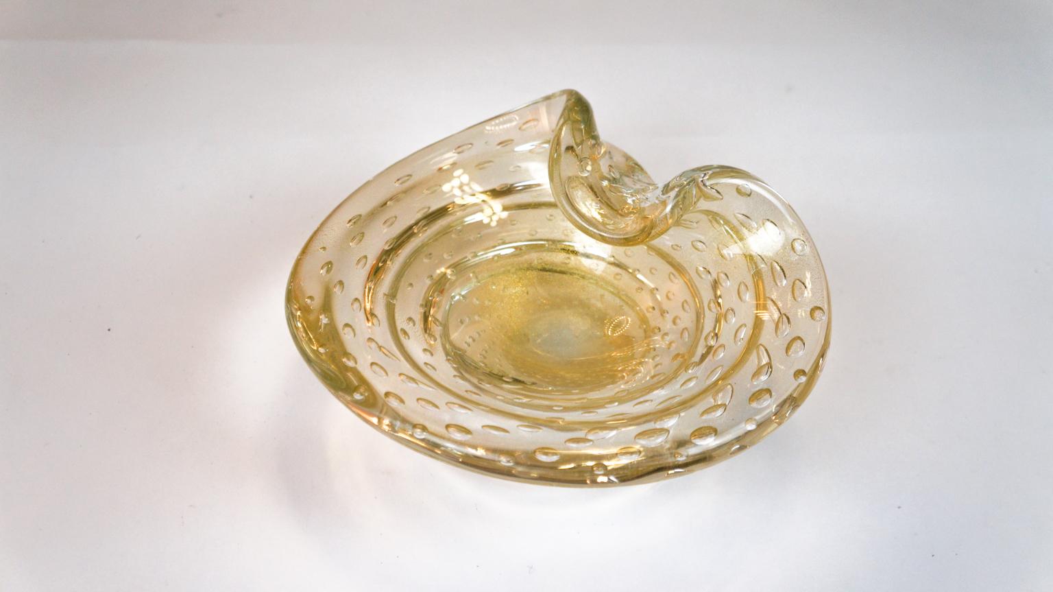 Beautiful Murano glass bowl colour crystal covered with gold leaf 24-carat and bubbles called Balloton.
The process of Venetian blown glass is completely performed by Murano artisans.
Designed by the master Alberto Dona' in 1980

Touching the