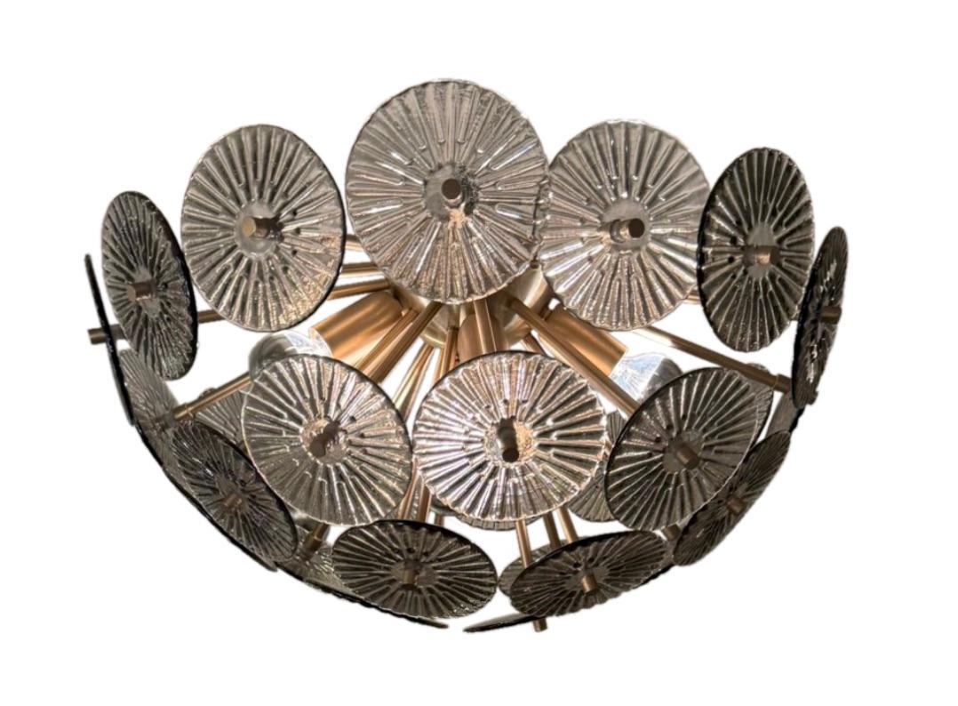 This striking flush mount fixture draws inspiration from the iconic work of Alberto Donà, a master of Murano glass celebrated for his bold forms, rich textures, and expert use of light and color. Handcrafted in Murano, Italy, the piece features a