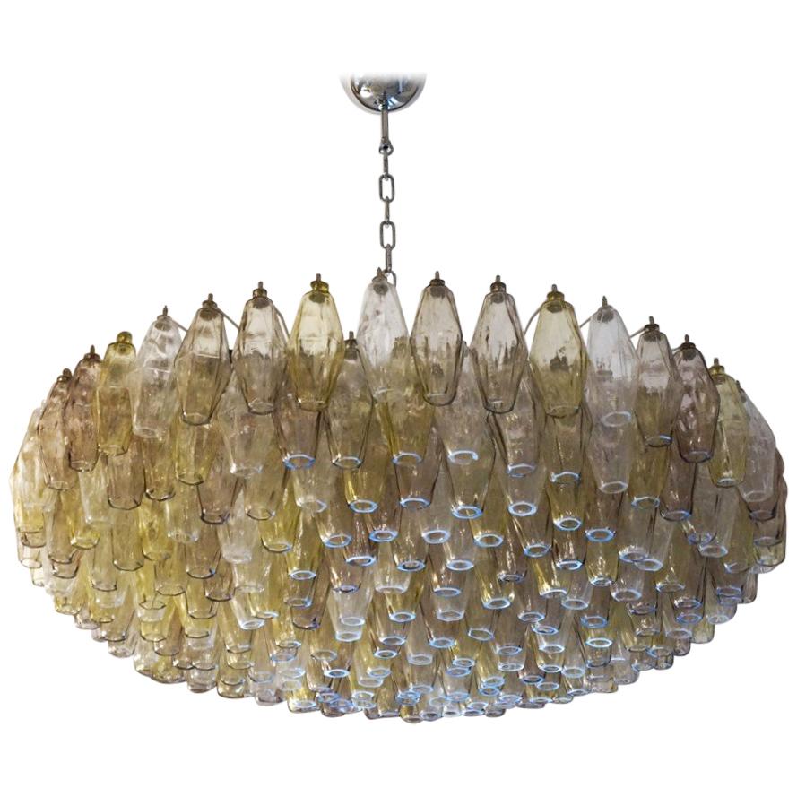 Large Murano blown glass Poliedri chandelier, with three color elements, crystal, amethyst and amber. This fantastic chandelier contains a total of 227 elements called Poliedri. 

This Classic developed in the 1960s and then reproduced by Maestro