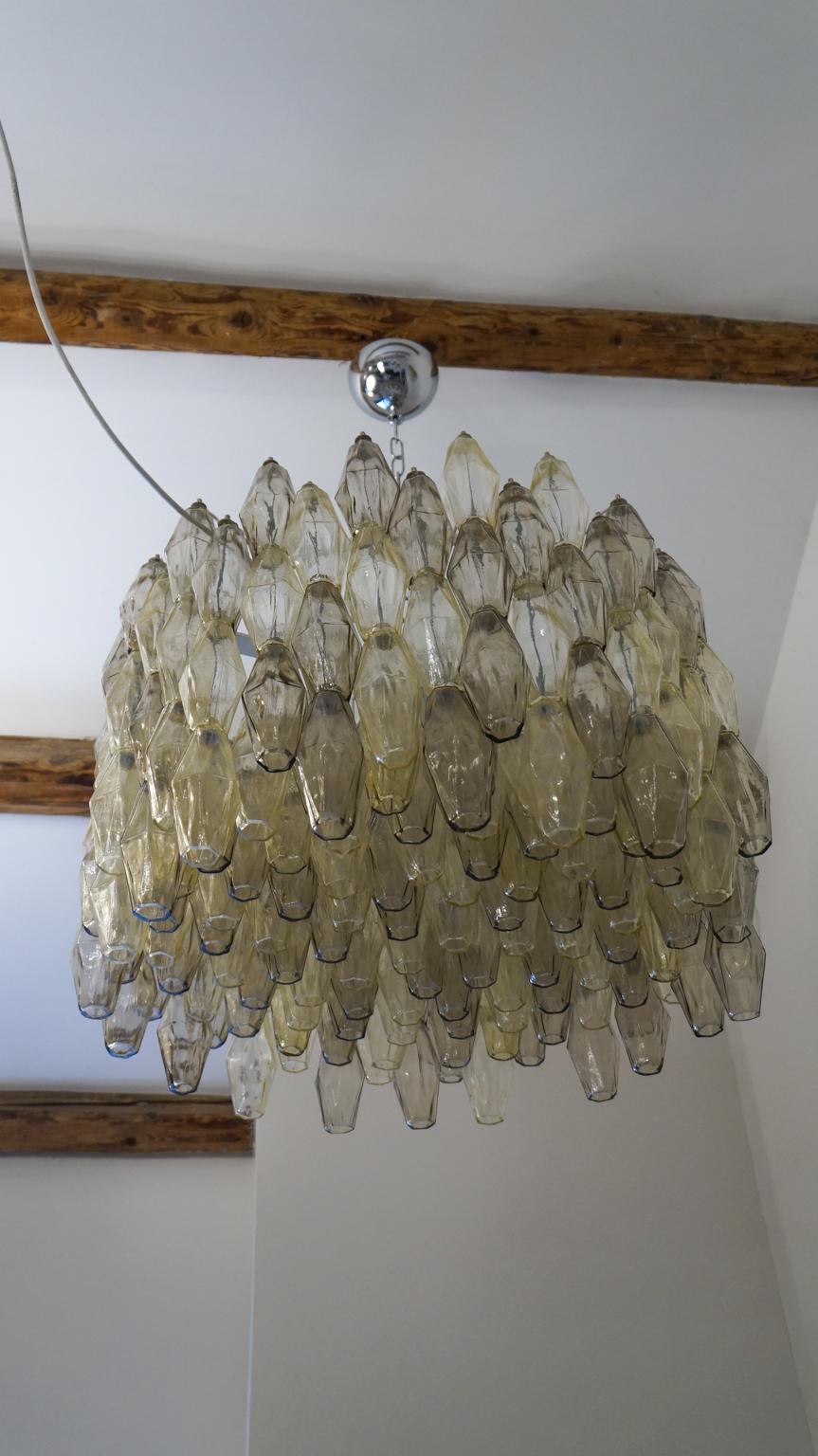 Murano blown glass Poliedri chandelier, with two color elements, grey and amber.
This fantastic chandelier contains a total of 192 elements called Poliedri.

This Classic developed in the 1960s and then reproduced by Maestro Alberto Donà in
