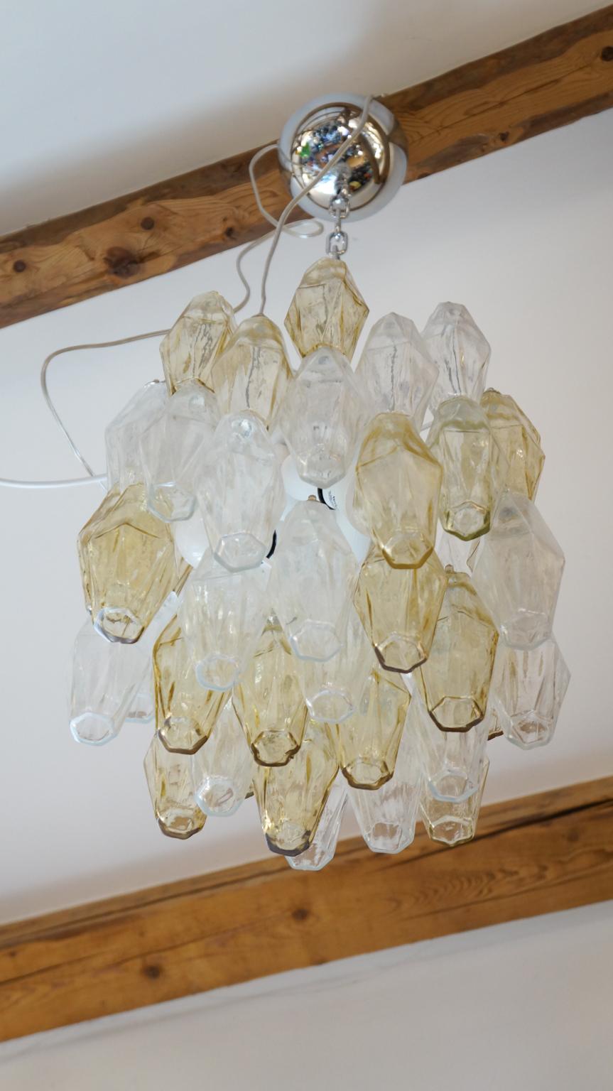 Murano blown glass Poliedri chandelier color amber and transparent elements. 
This fantastic chandelier contains a total of 48 elements called Poliedri. 

This Classic developed in the 1960s and then reproduced by Maestro Alberto Donà in