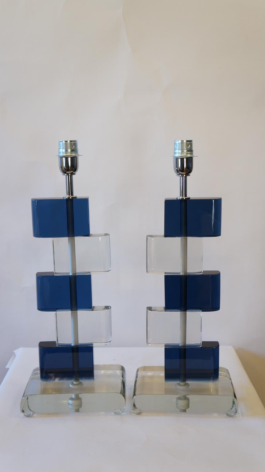 Two Murano glass table lamps by Alberto Donà in 1975. 
In it we can see simplicity, elegance, linearity. It is, in fact, a simple model, and it is thanks to its colors that its beauty stands out. 
We note in fact the combination of blue and