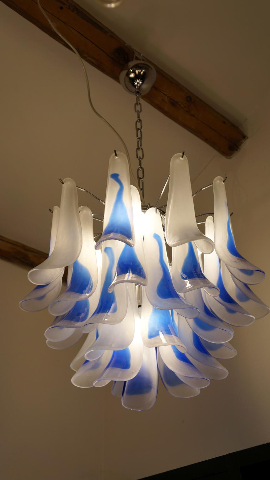 A very elegant chandelier, with glass elements called 