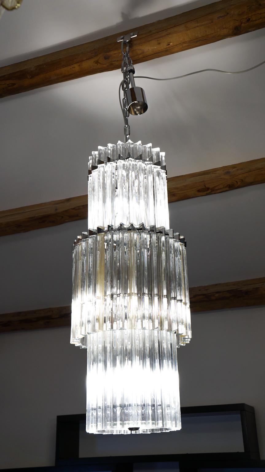 Murano blown glass chandelier with 79 crystal and gold leaf 24-karat elements. This typical chandelier is the specialty of our glassmaster. The assistants take a small quantity of glass from the oven. Being its consistence like honey it gives the