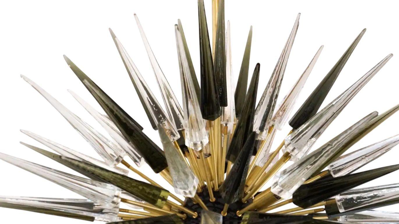 A striking and sculptural Sputnik chandelier composed of 121 crystal Murano glass elements, designed by Alberto Donà in 1995. With a generous diameter of 45.25 (115 cm), this chandelier is perfectly suited for large, contemporary interiors, where