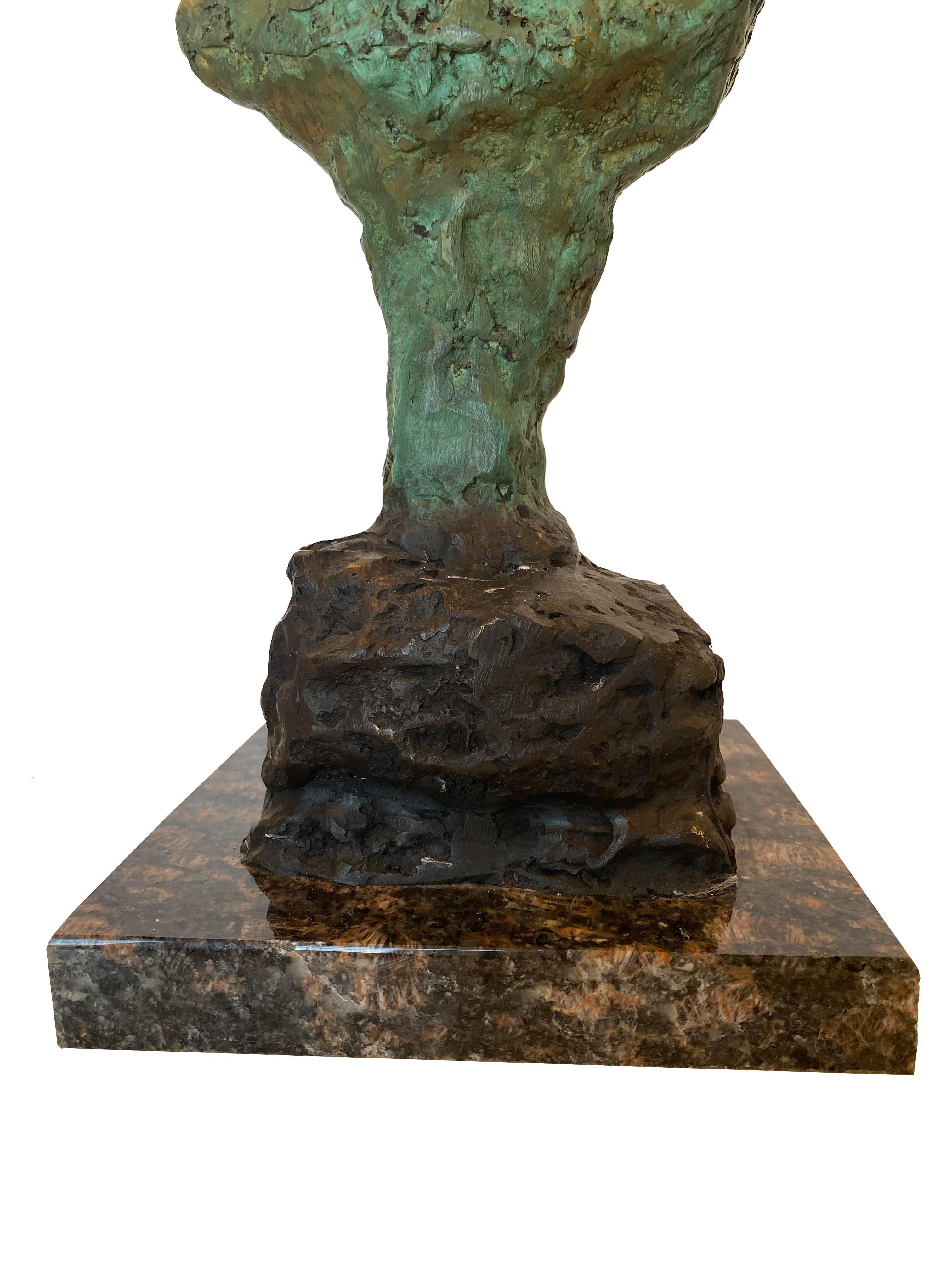 An exquisite bronze bust sculpture crafted by the renowned artist Alberto Giacometti. This remarkable piece is signed on the back of the sculpture and numbered 7/30, adding to its rarity and collectibility. The sculpture features a verdigris