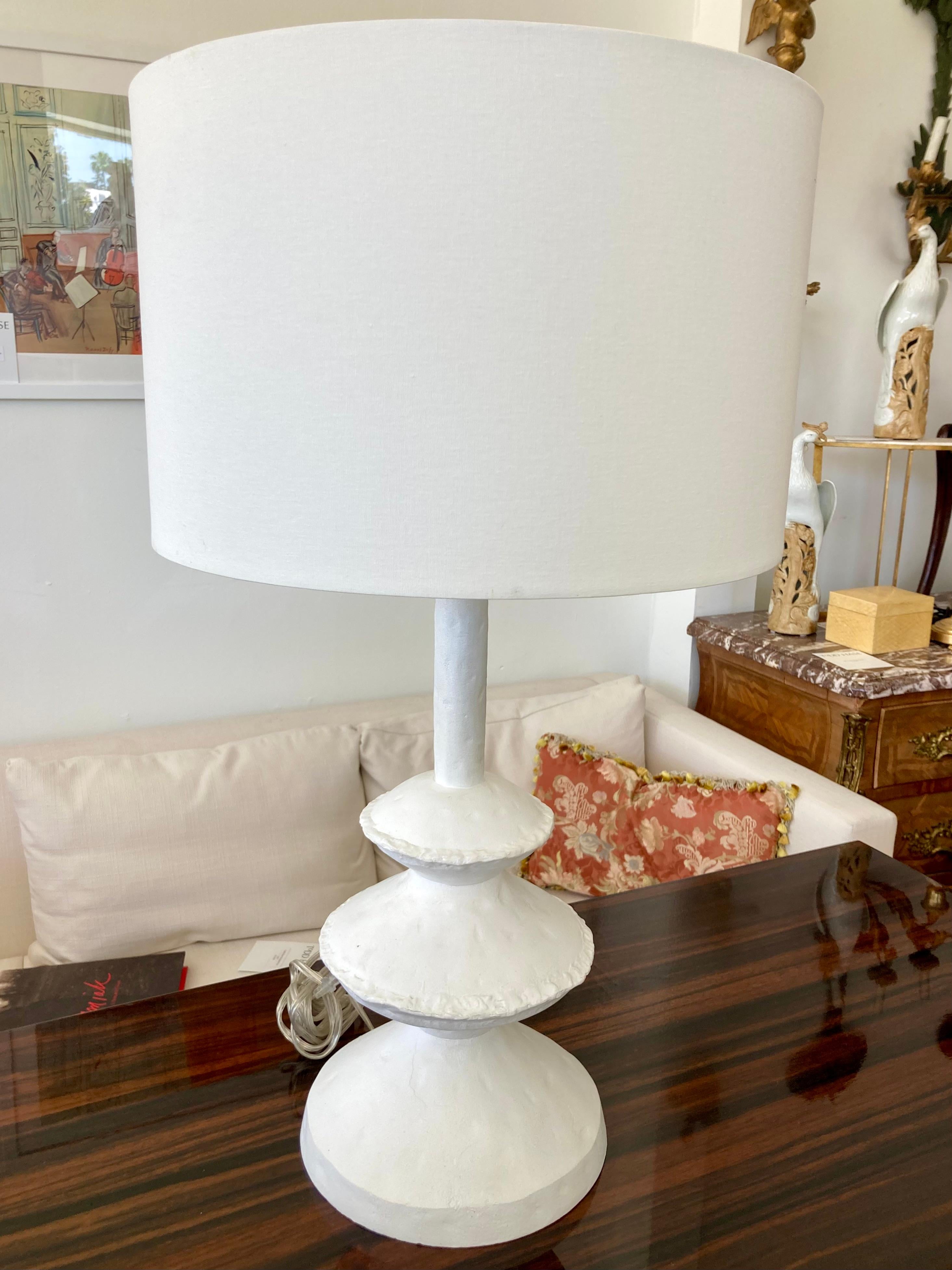 Beautiful Alberto Giacometti style plaster table lamp with nice modern shade. Great addition to your Boho Chic inspired home and table tops. Very cool modern form!