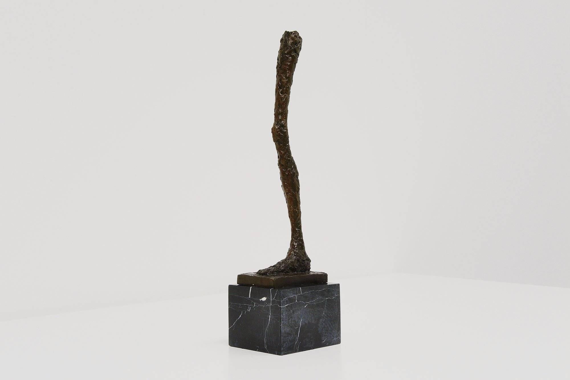 Very nice abstract modern bronze leg shaped sculpture in the style of Alberto Giacometti. This sculpture was made and most probably inspired by the work of Giacometti as many others did after him. This leg is made of solid bronze and has a very nice