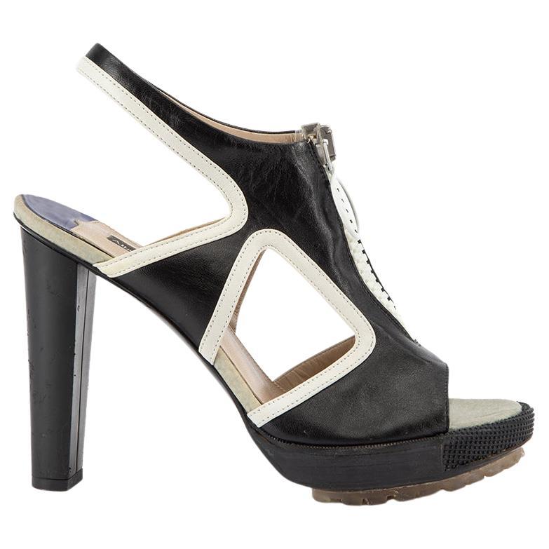 CONDITION is Very good. Minimal wear to heel is evident. Indentation marks on both heels is seen on this used Alberto Guardiani designer resale item. 
 

 

 

 Details
 

 

 Black and white
 

 Leather
 

 Platform high block heel
 

 Peep toe
 

