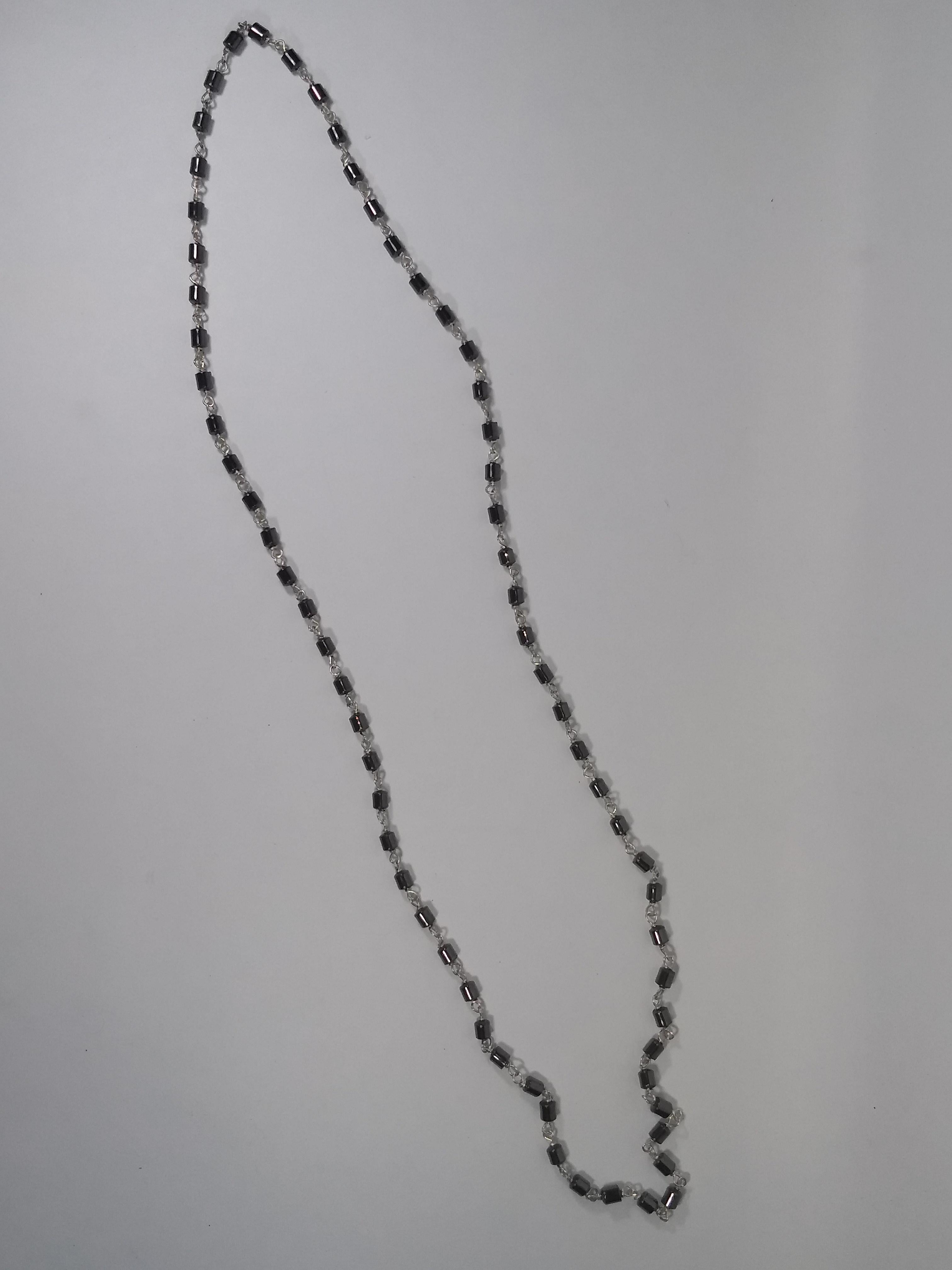 This Alberto Juan one of a kind necklace was handmade from hematite beads and sterling silver. Necklace measures 27