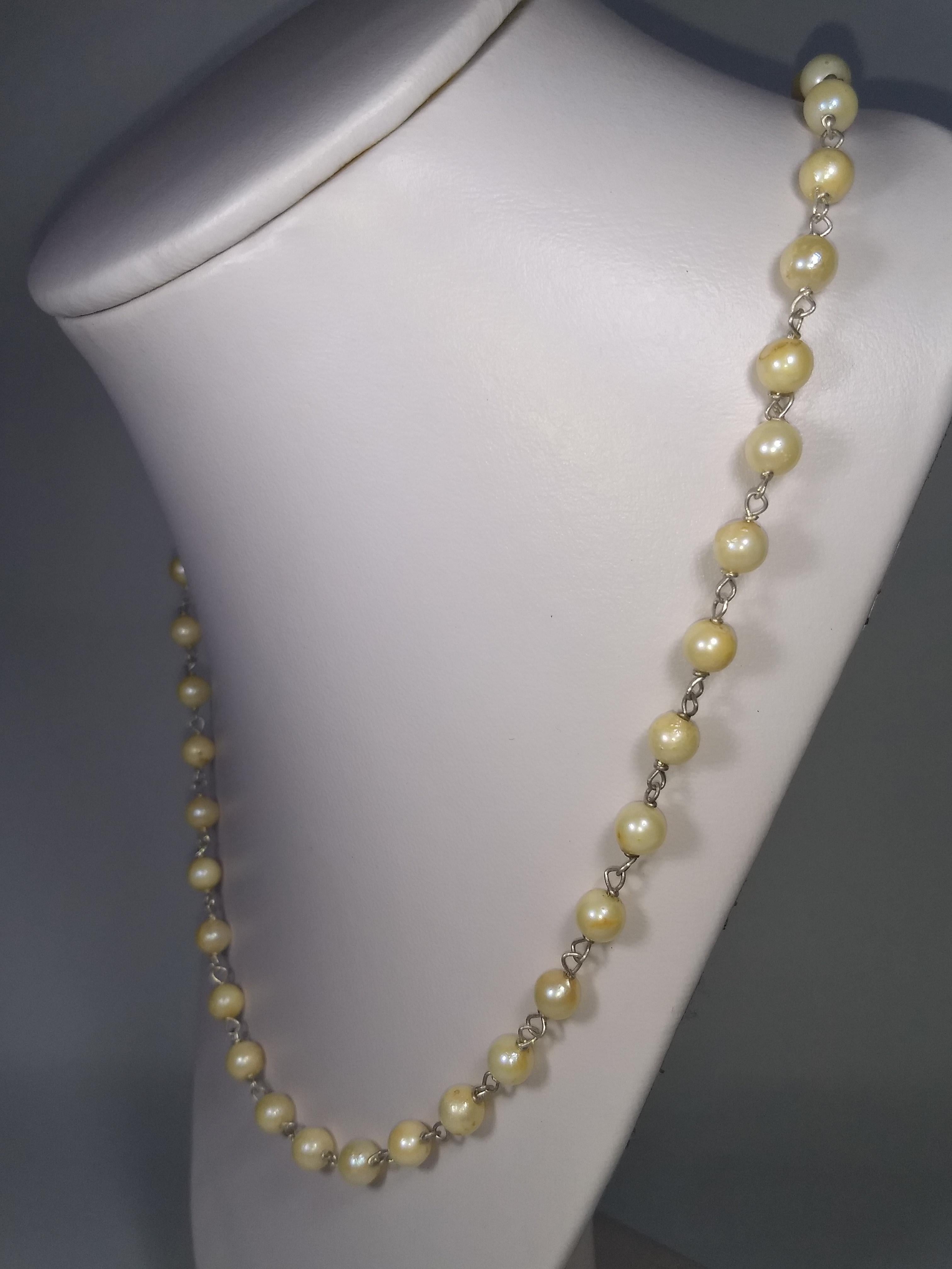 This Alberto Juan one of a kind necklace was handmade from natural baroque pearls and sterling silver.  The chain and findings used in this piece are sterling silver. Necklace measures 27