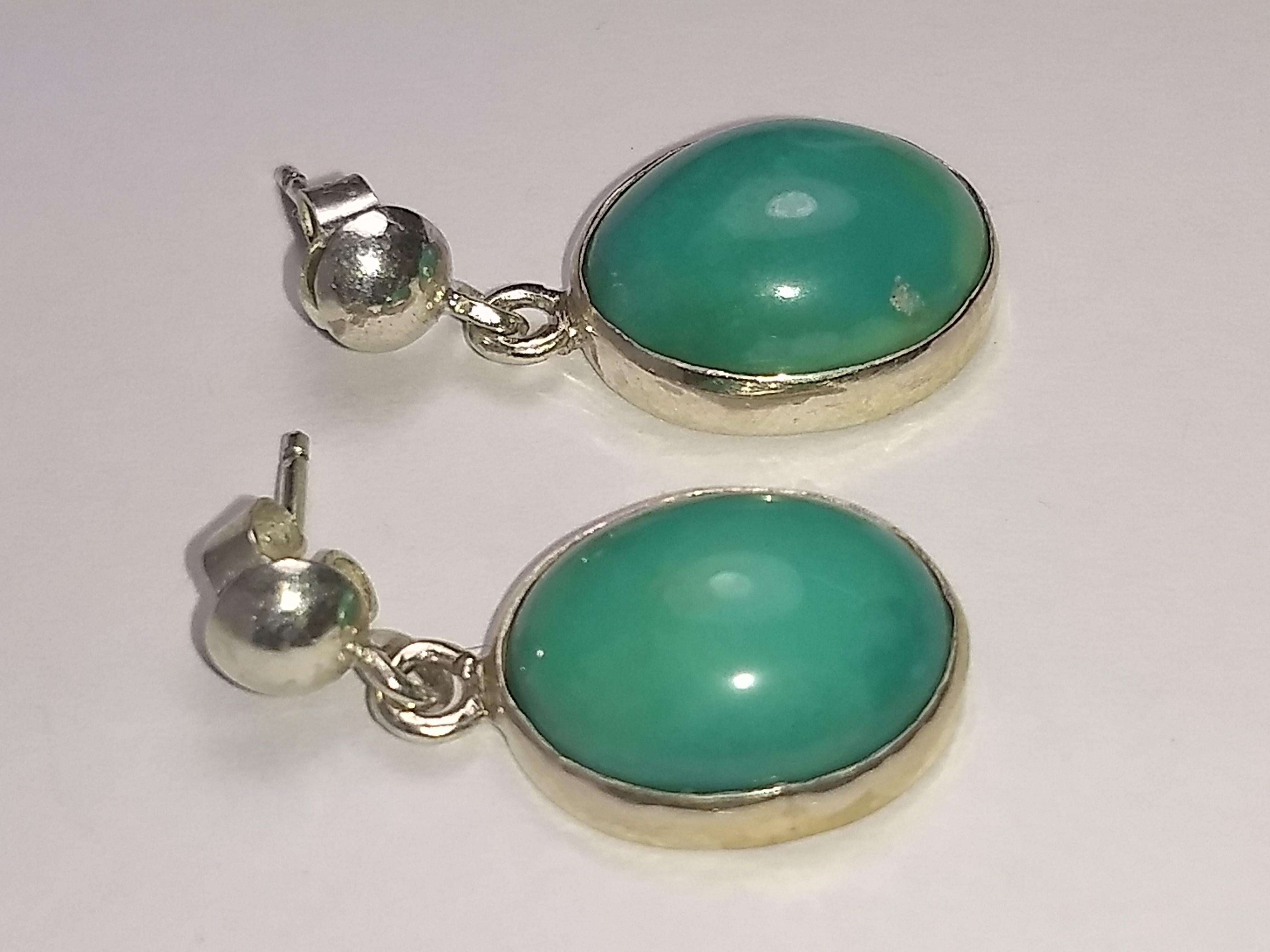 This Alberto Juan handmade one of a kind earrings were made from 18.5 carats of natural blue turquoise cabochons and sterling silver, unmarked. Earrings are 1