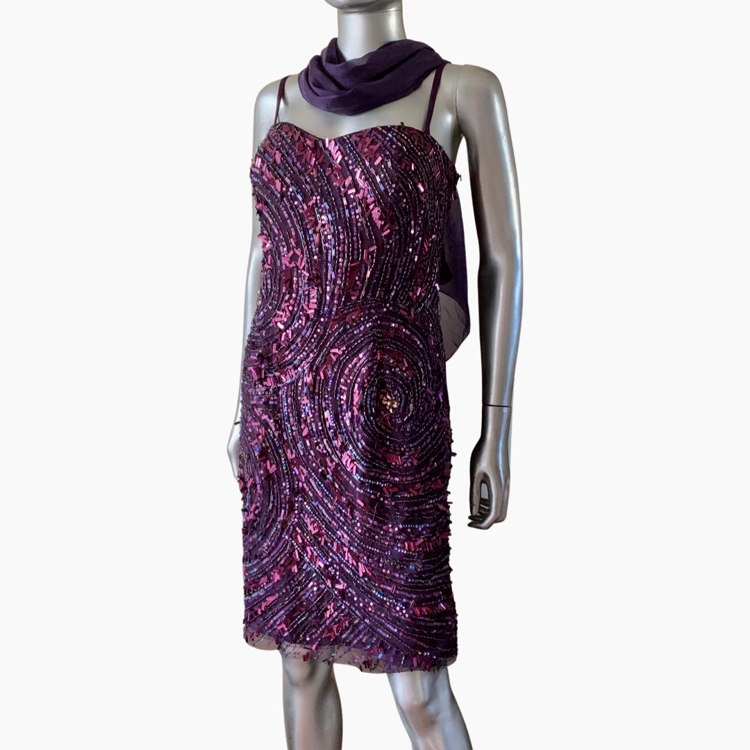 The beading detail on this dress is just a work of art. So much detail all hand beaded. Found in a Palm Springs Fashionista’s closet it was never worn! NWT. the construction of this dress is amazing. Bustier built in with fully purple lining. Has a