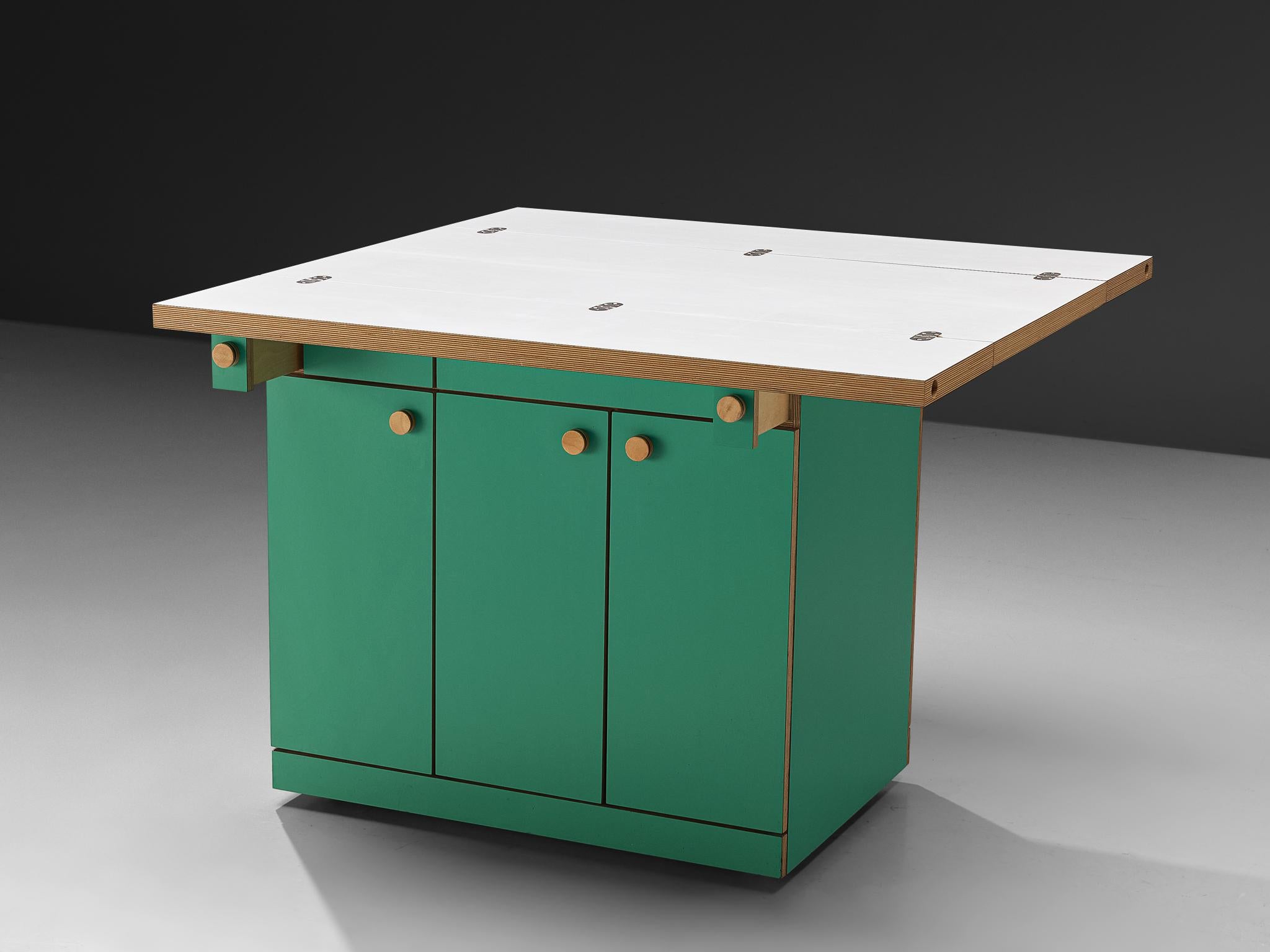Alberto Paoli, drop-leaf kitchen island or work table, laminated plywood, Italy, 1970s. 

A peculiar piece of furniture designed by the Italian Alberto Paoli that perfectly embodies the bold and experimental 1970s era. It can be interpreted as a
